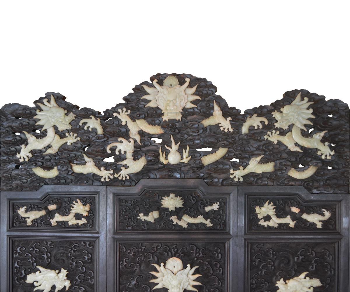 Hand-Carved Massive Chinese Jade Screen with Jade Dragons Among Intricately Carved Clouds For Sale