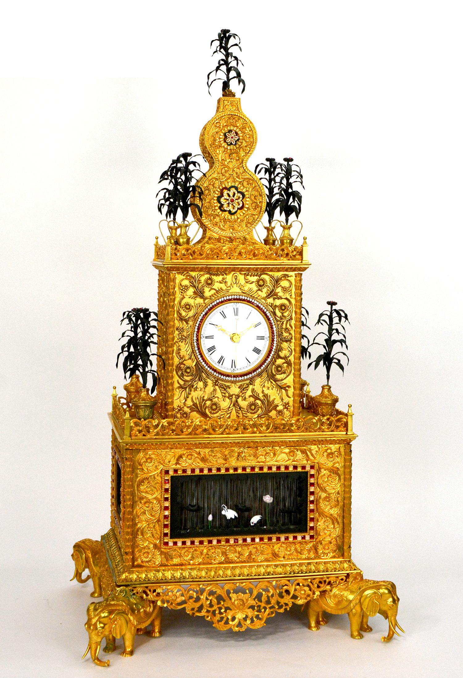 Massive Chinese Ormolu High Relief Bronze Elephant Automaton Music Bracket Clock

A truly magnificent Chinese Guangzhou studio automaton clock , large triple deck body supported on the back of four elephants , extremely ornate bronze case, floral