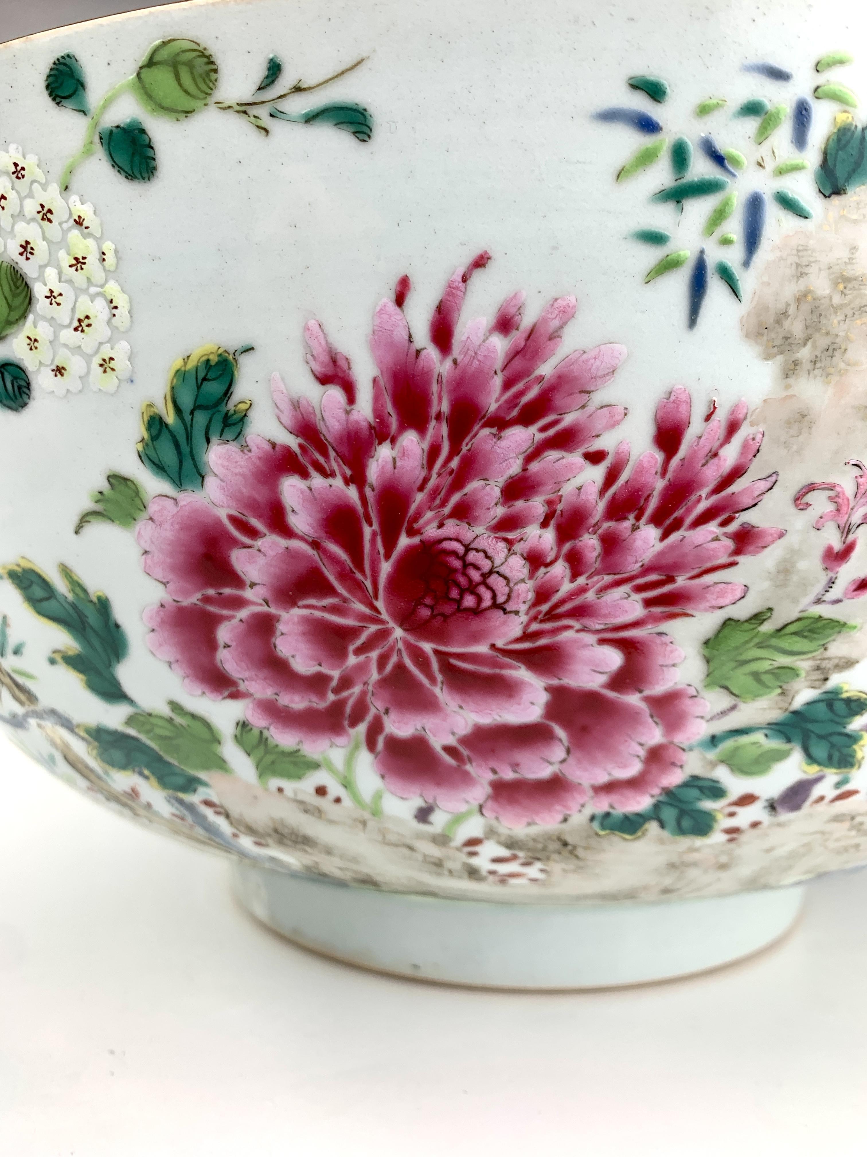 An altogether fabulous bowl! 
The hand-painted Famille Rose decoration on this bowl is exquisite and vibrant.
Painted on the outside of the bowl are superb pink and white peonies and beautiful clusters of plum tree flowers painted in cheerful pale