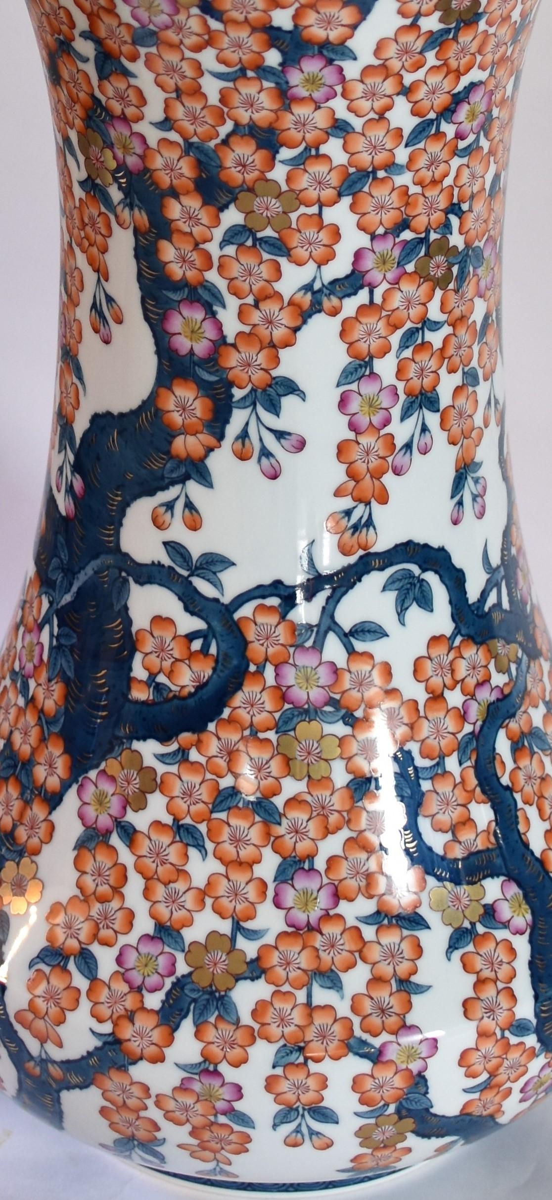 Extraordinary massive contemporary Japanese porcelain vase, extremely intricately hand painted in blue and red on a very large porcelain body with an astonishingly beautiful shape and flared top, a signed masterpiece by highly acclaimed