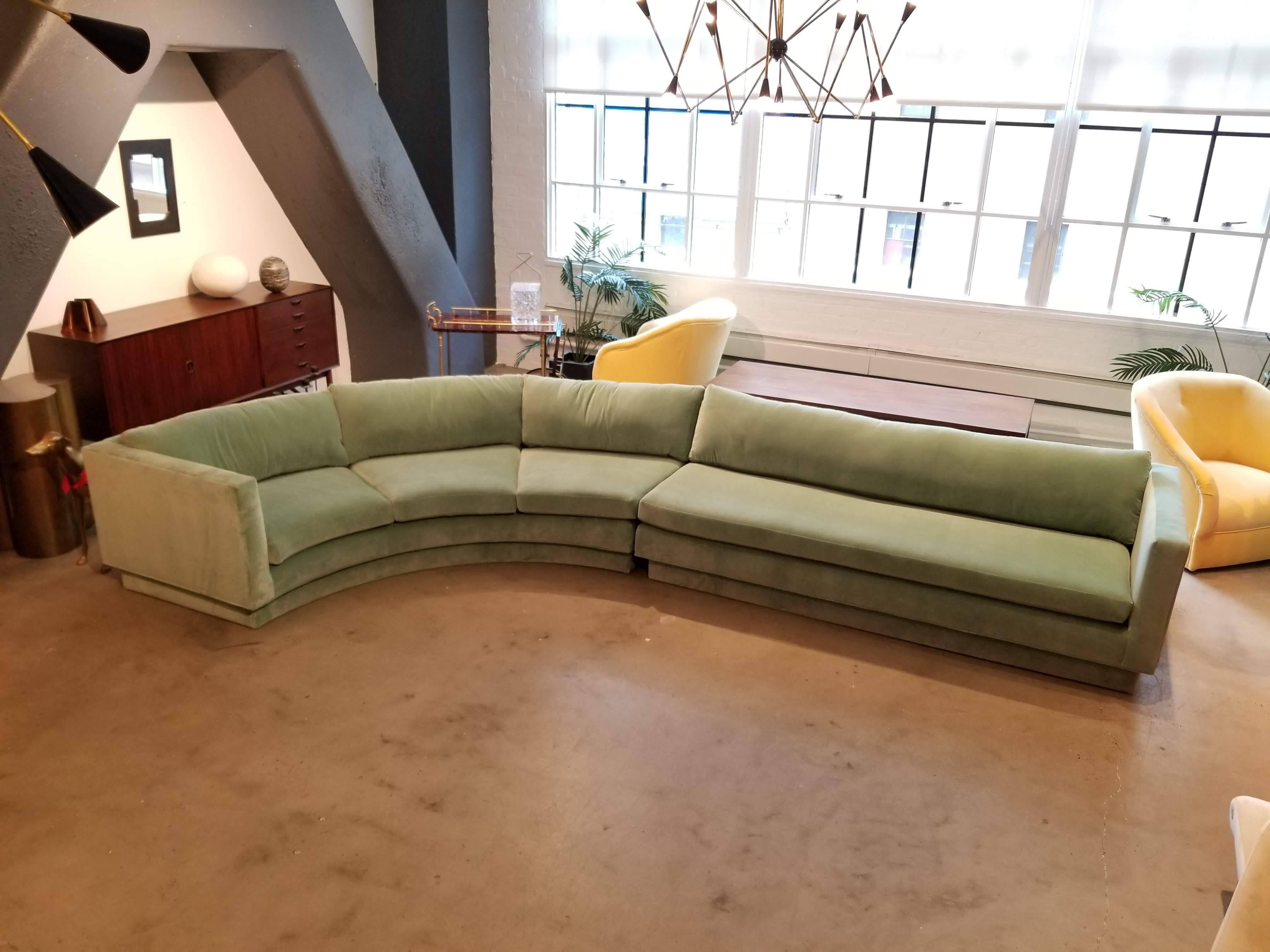 Monumental curved sectional (2 sections) sofa by Directional Furniture, circa 1980s-1990s. This piece has just been fully restored in a luxe Paris Green velvet and all new down and foam. Back cushion are plush yet firm and offer great support--the