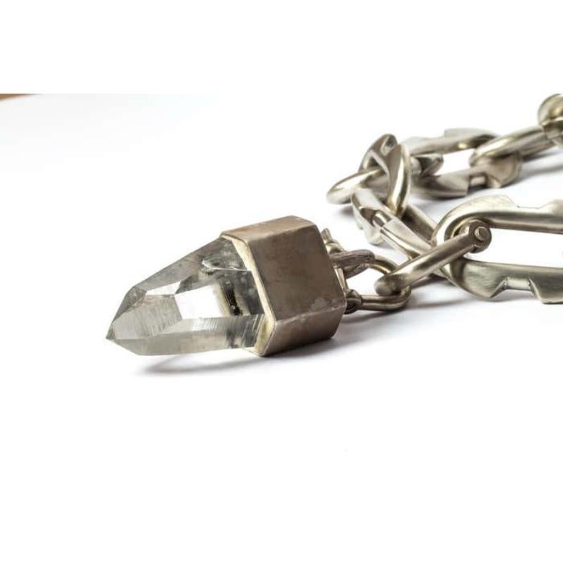 Chain necklace in bronze with lemurian charm on sterling silver cap.
The Charm System is an interrelated group of products that can be mixed and matched or worn individually.
Chain link size (L × H): 70 mm × 43 mm
Chain length: 550 mm
U-bolt