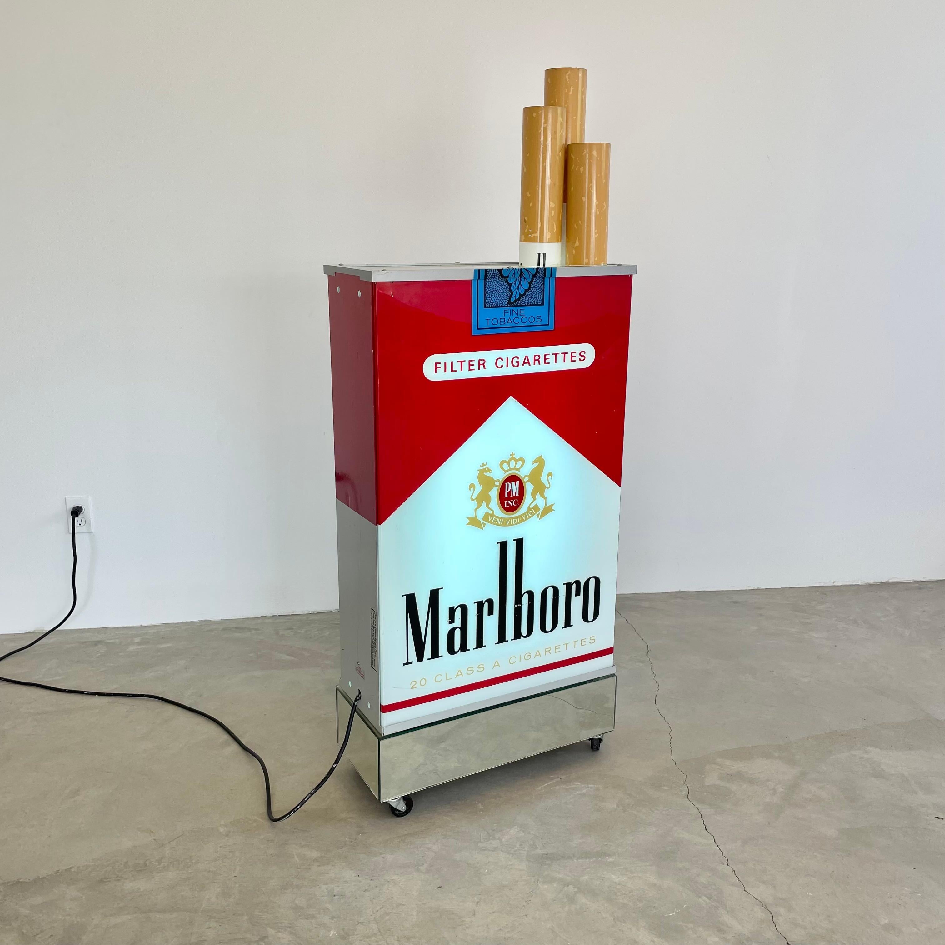 Fantastic vintage advertising light up box by Marlboro. Massive scale. Double sided. Excellent condition. Looks great hanging on the wall or on the ground. Acrylic sides and cigarettes with metal frame. Electrical works perfectly. Newly rewired.