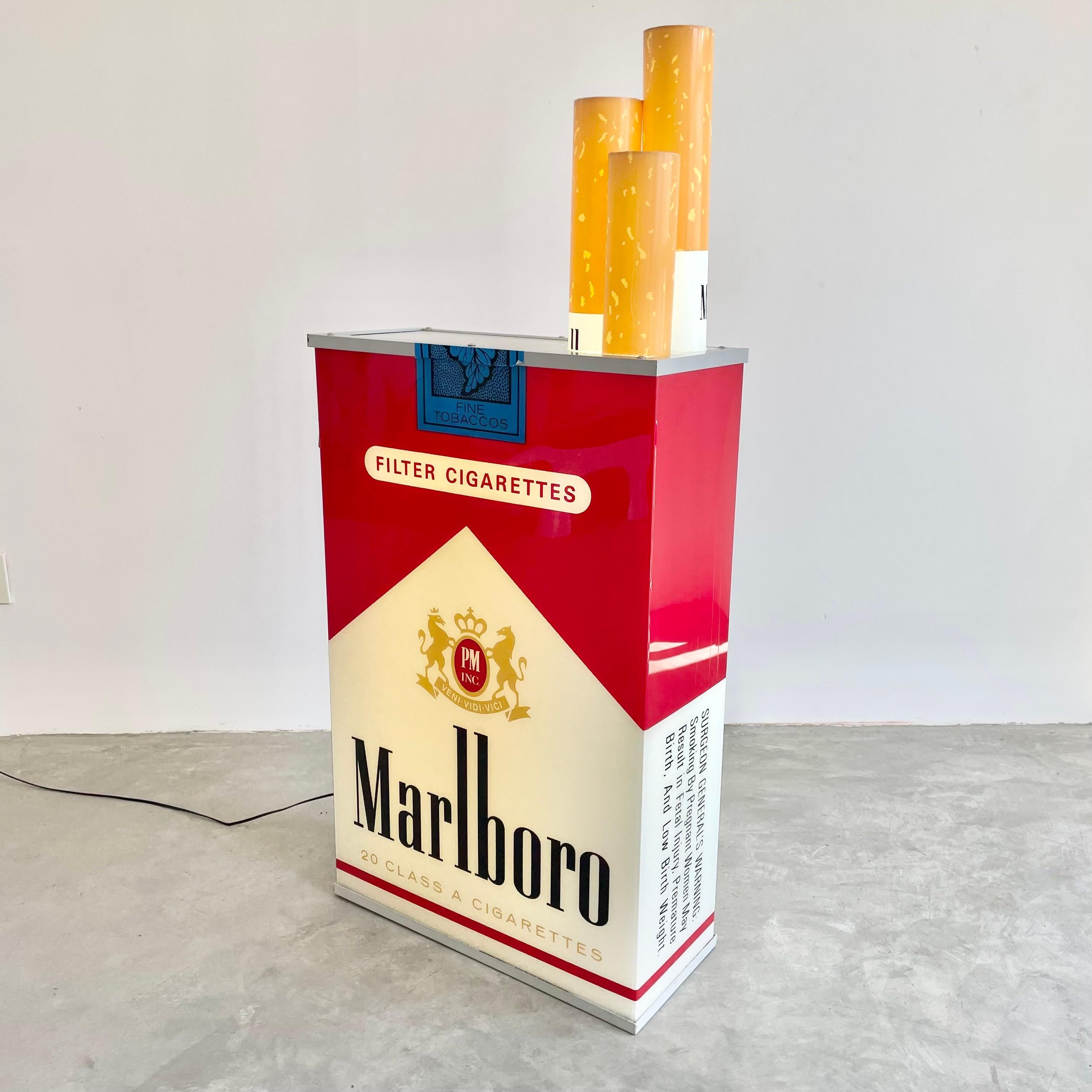 Fantastic vintage advertising light up box by Marlboro. Massive scale. Double sided. Excellent condition. Looks great hanging on the wall or on the ground. Acrylic sides and cigarettes with metal frame. Electrical works perfectly. Newly rewired.
