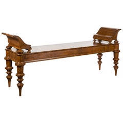 Massive English Mahogany Bench with Curving Arm Supports and Turned Legs