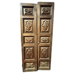 Massive entrance door, carved in walnut wood, Italy