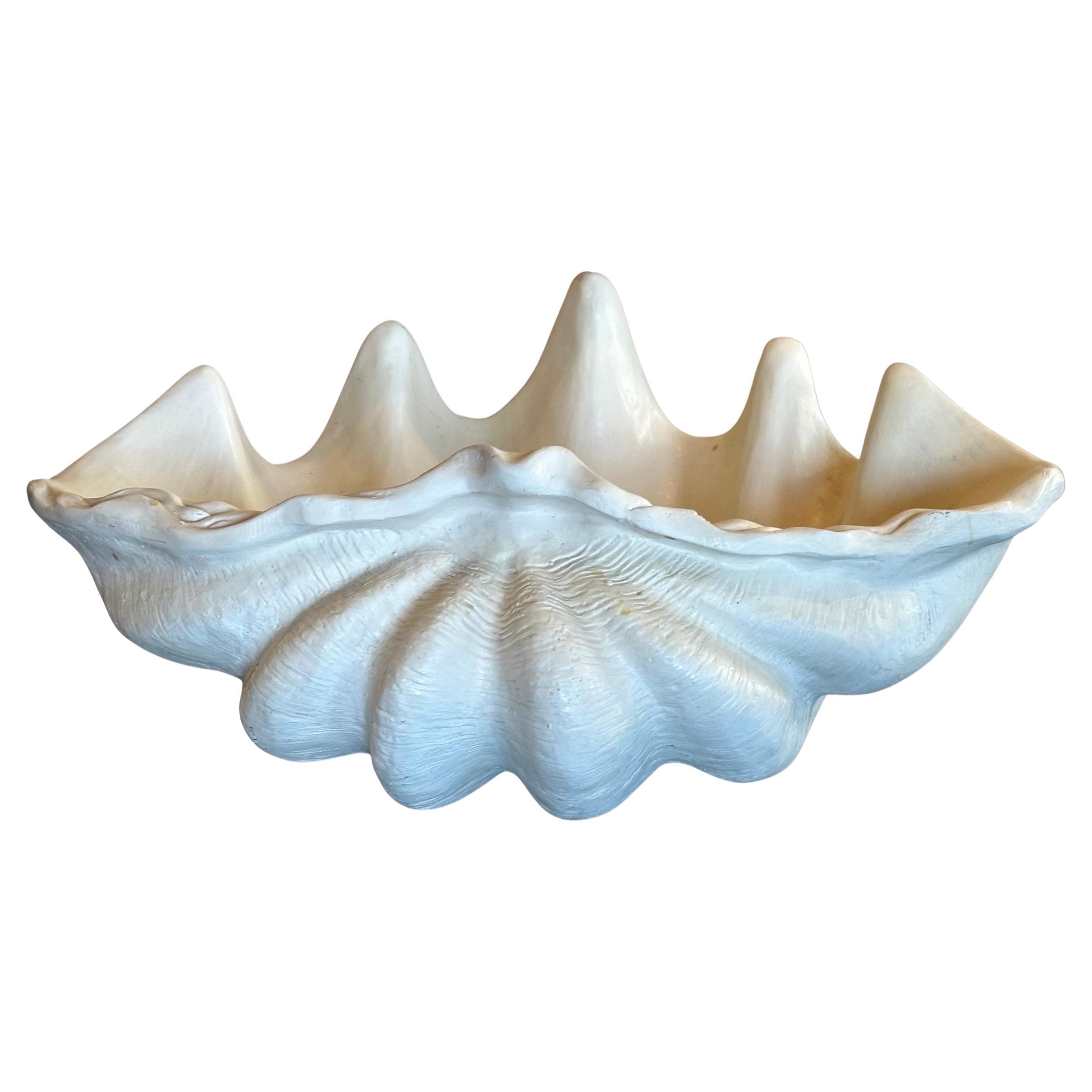 A massive faux sculptural giant south Pacific Ocean clam shell (Tridacna gigas), circa 1990s. This piece is in very good condition and measures 28