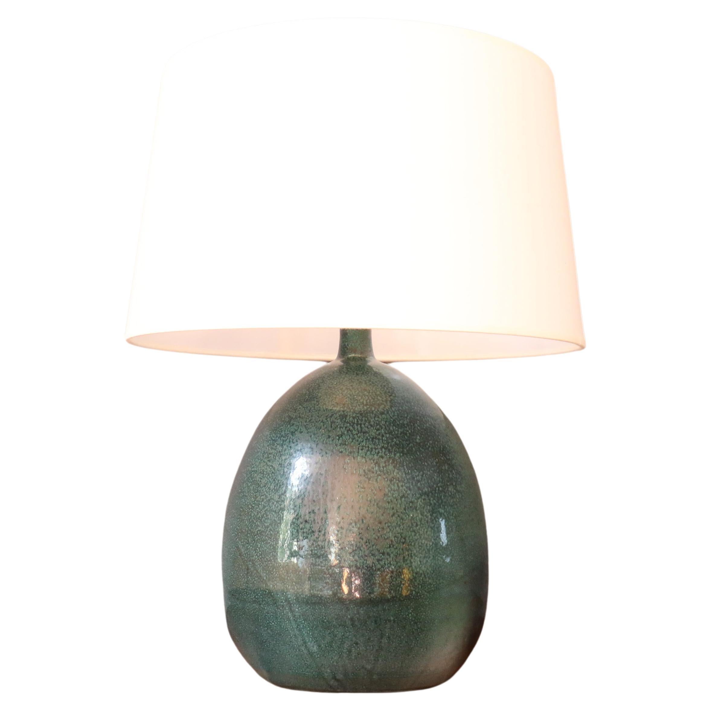 Massive French Ceramic Lamp by Roland Zobel, 1960, era Capron, Jouve, Ruelland

Lovely ceramic lamp by the french ceramist Roland Zobel.
The deep green enamel is very beautiful, shiny and soft to the touch. 

Heigh : 50cm with the lamp shape, 33cm