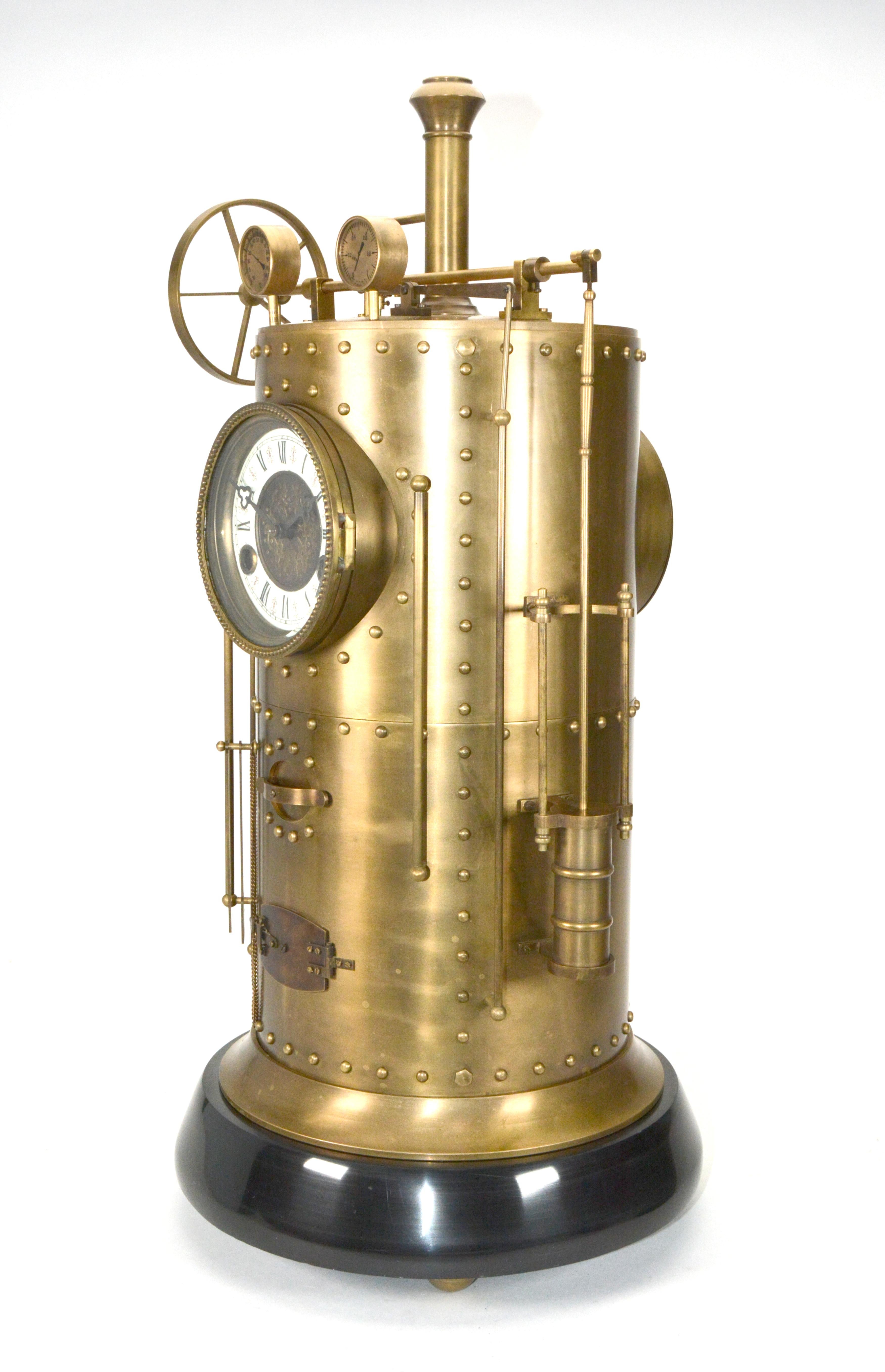 Large French Style 8 Day Brass Automaton Steam Engine Industrial Clock 

Here we have a wonderful example of the industrial series popular in French horology. While the clock is striking, the powertrain wheel spins around, which really puts life