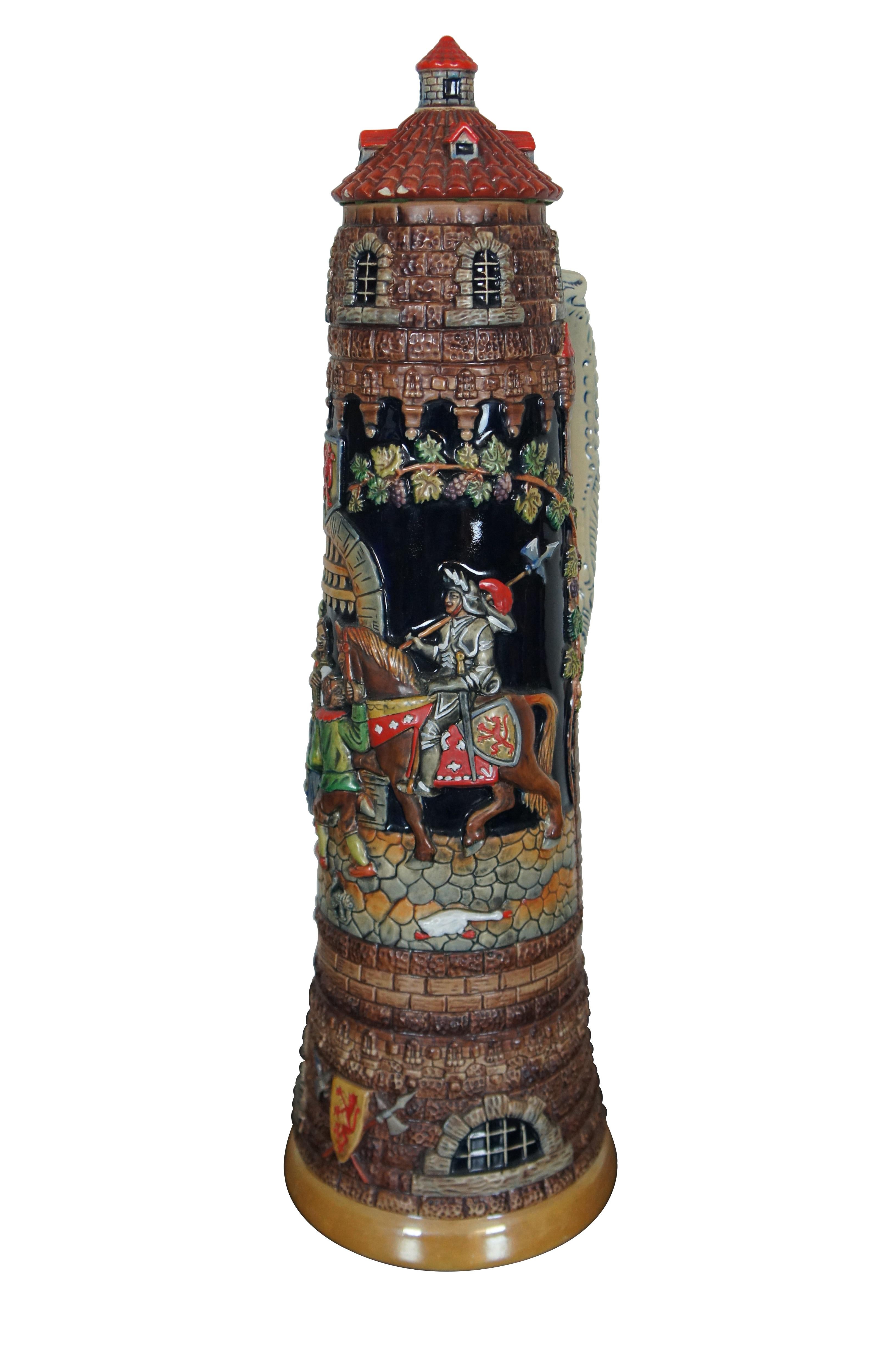 Oversized German Werner Corzelius five liter beer stein, lidded mug or tankard featuring a middle age castle theme with a knight or soldier riding horse on cobblestones through the tower gates, being greeted by a group of people and some wild