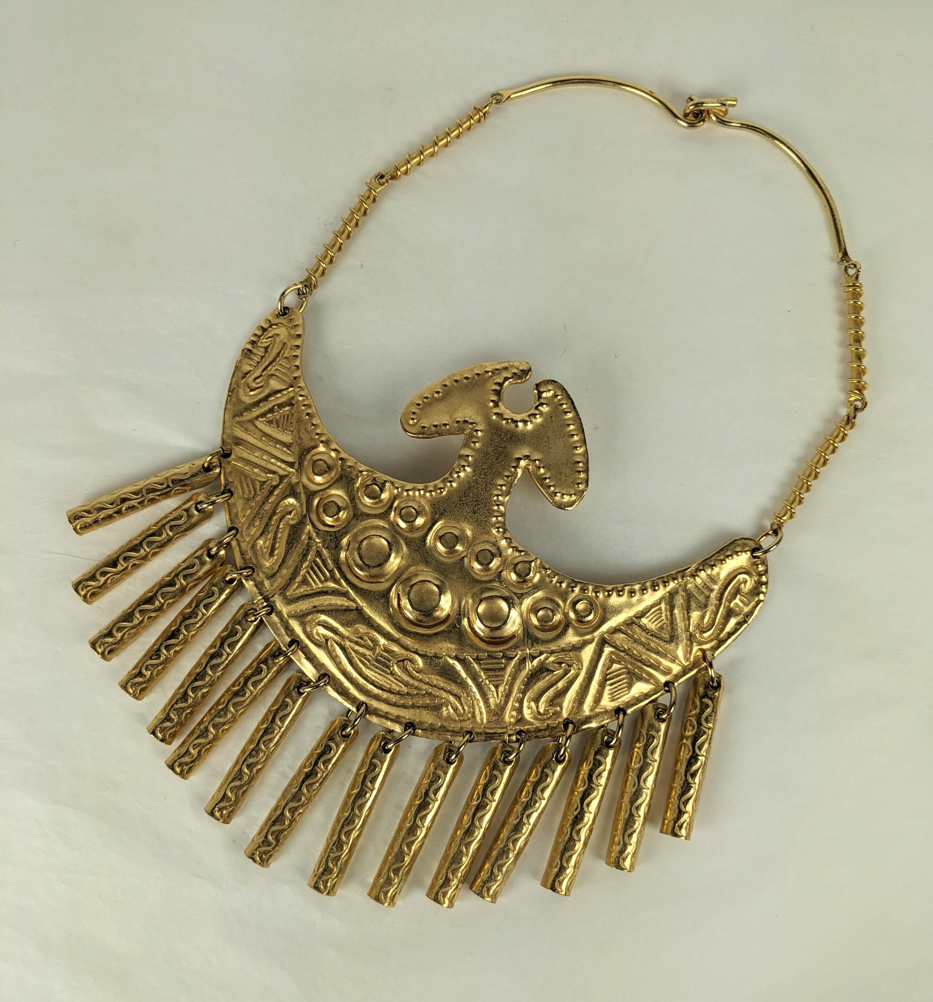 Massive Gilt Breast Plate Necklace from the 1960's. Based on an ethnic design with etched drops along the lower edge. Chain of wire wrapped rods with hook closure, unsigned but likely by Alexis Kirk. Amazing scale perfect for caftan or simple