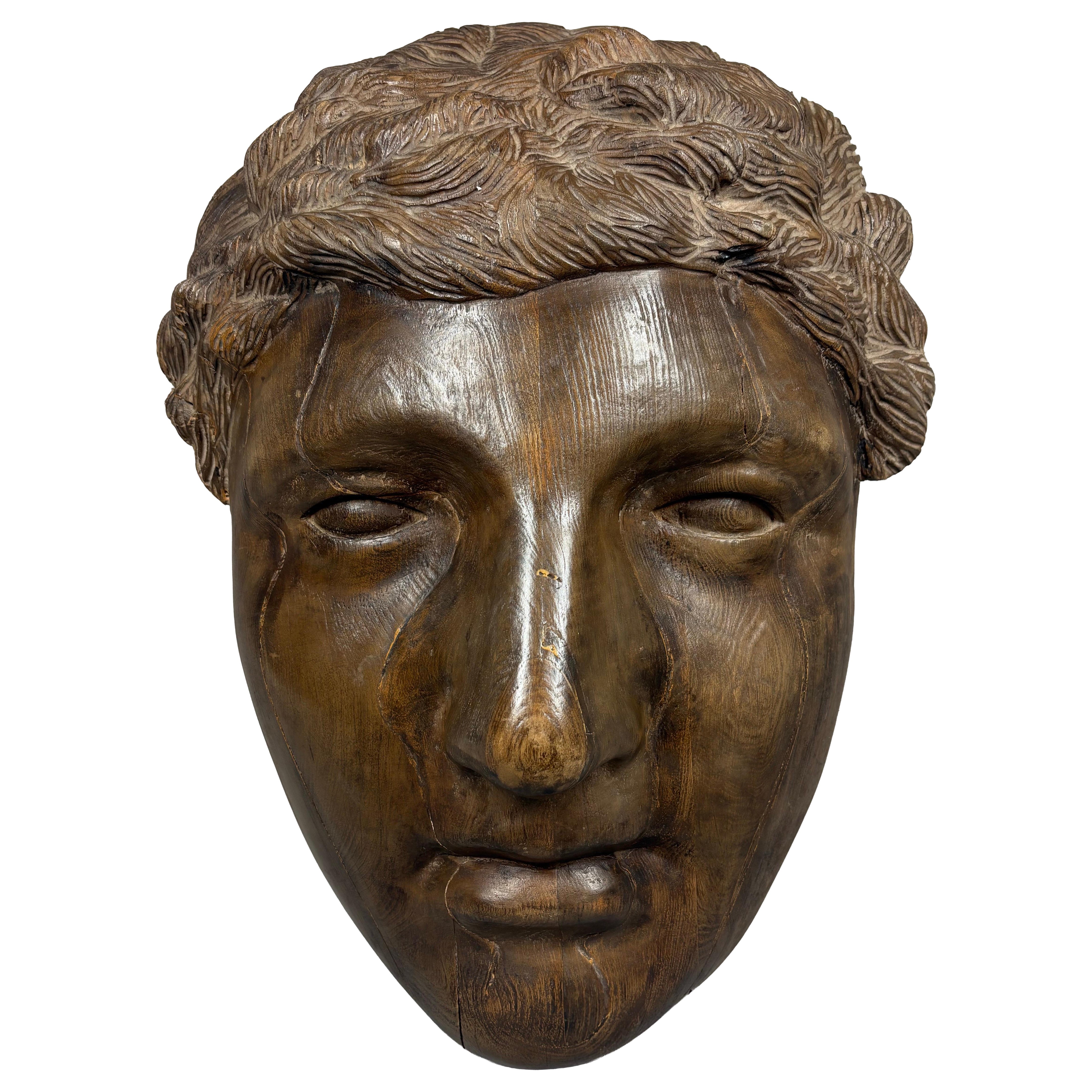 Massive hand-carved wood Greco-Roman face wall sculpture