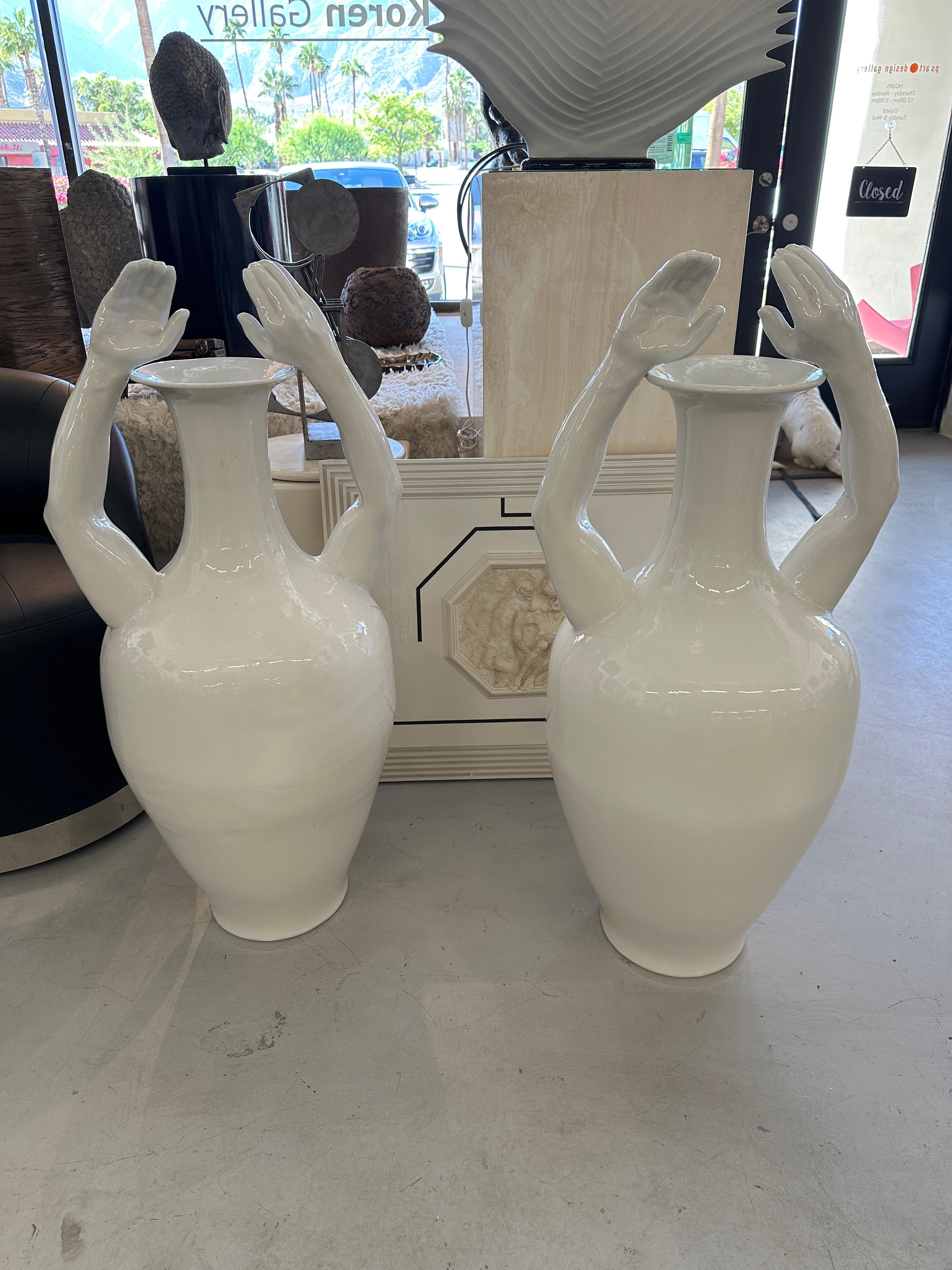 Stunning pair of massive “Hand” vases by Pols Potten of The Netherlands. Marked PP Global from Holland on a sticker. These appear to be hand thrown with ribbing up the pieces. Beautiful white glaze. In good condition with only some minor original