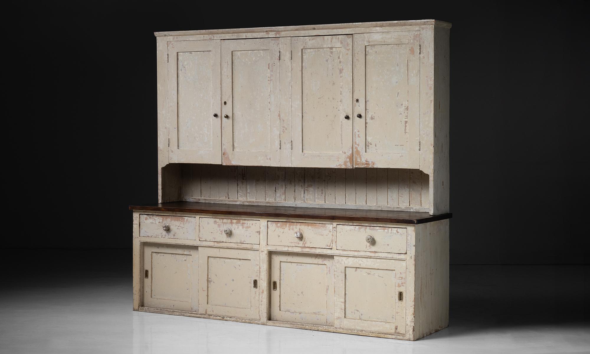 Massive Housekeepers Cupboard

England circa 1860

Constructed in pine, with original painted surface and stained counter top.

Measures 110.25”L x 30”d x 100”h x 37.5” surface height