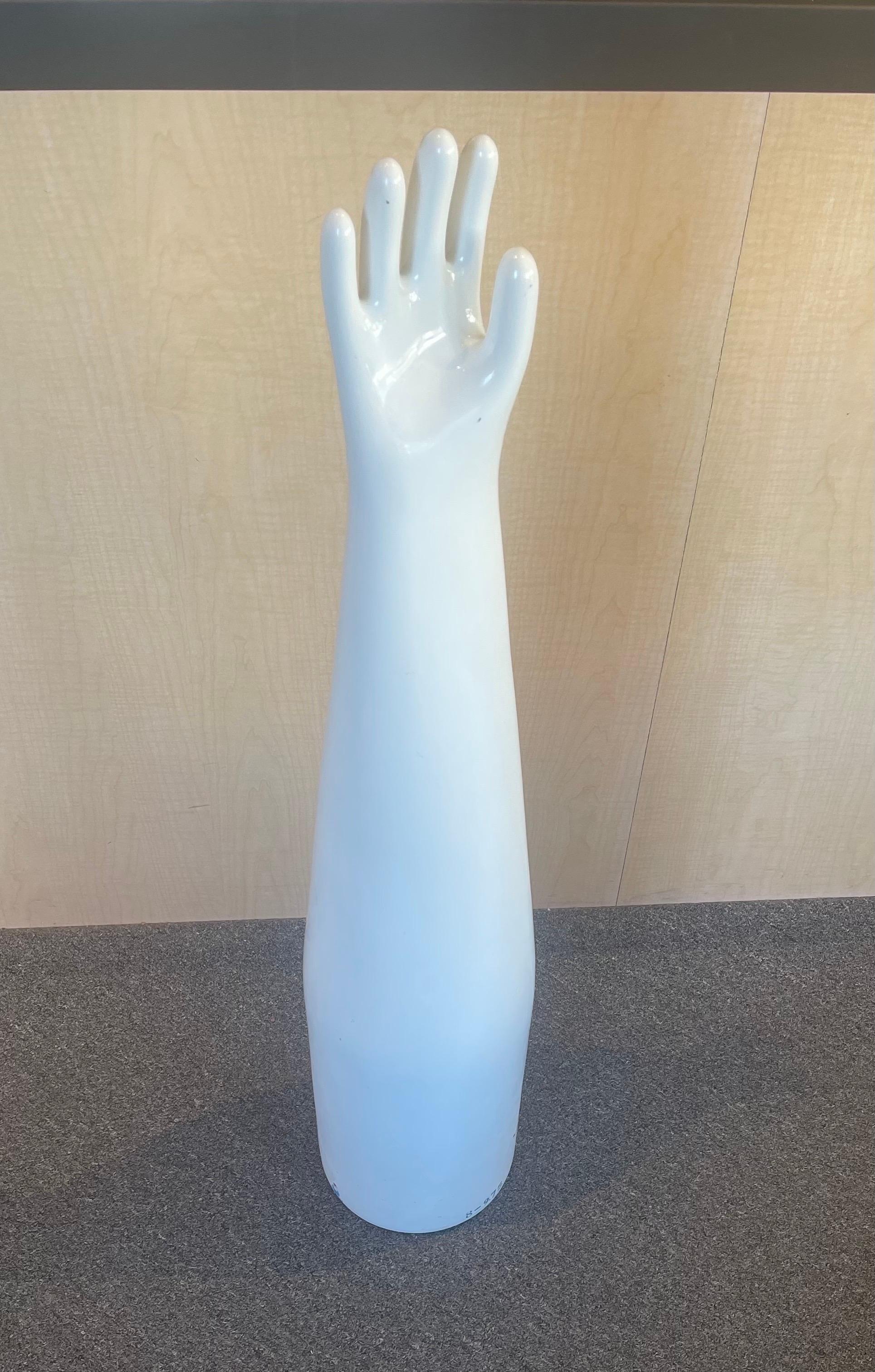 Massive industrial ceramic glove mold by Japnese manufacturer Shinko, circa 1970s. The piece is a cool decorative item that is in excellent condition and can stand as a floor piece; measures 39