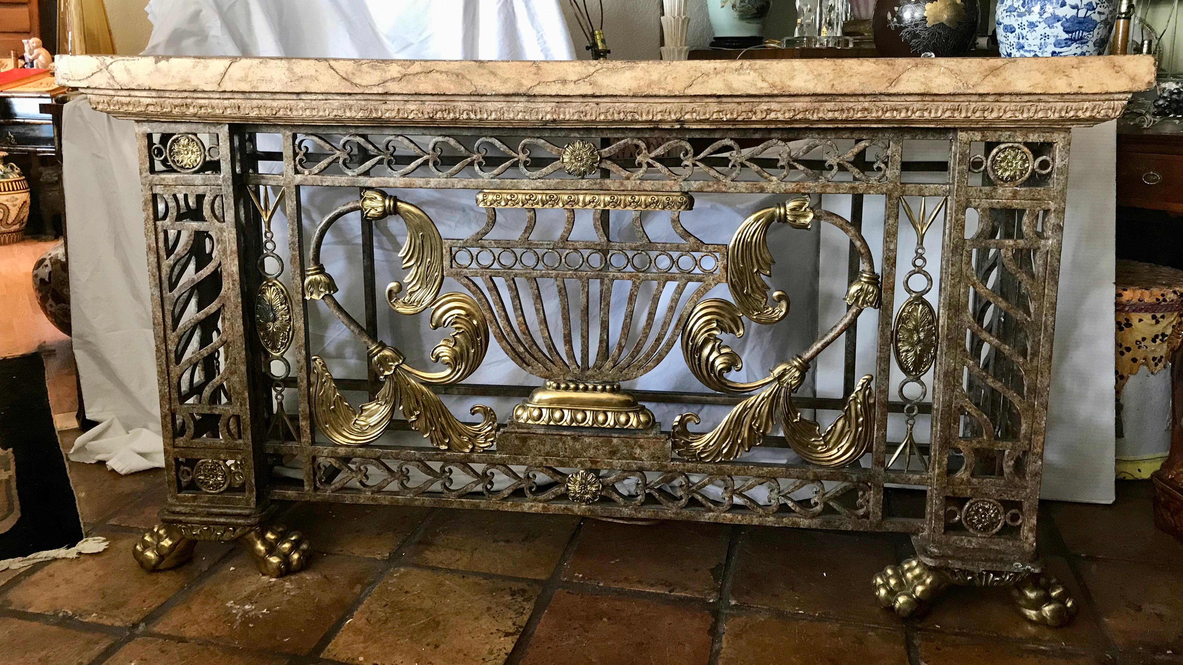 The console is fashioned with a central urn flanked with 