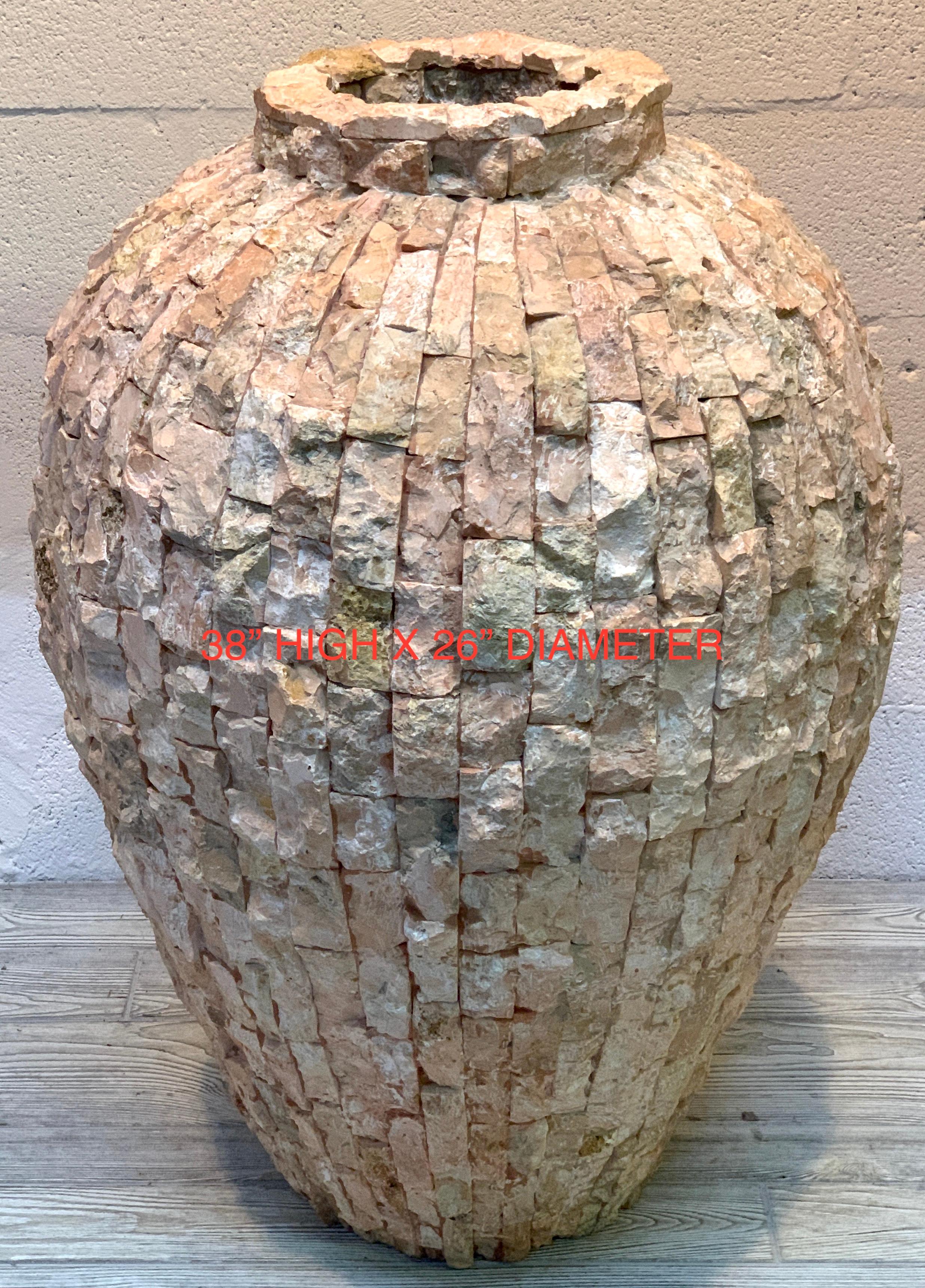 Massive Italian midcentury coral stone mosaic floor vase, standing over 3 feet tall and over 2 feet in diameter, with countless naturalistic subtle coral colored stone (marble or travertine) covering the entire surface. Can be used indoors or