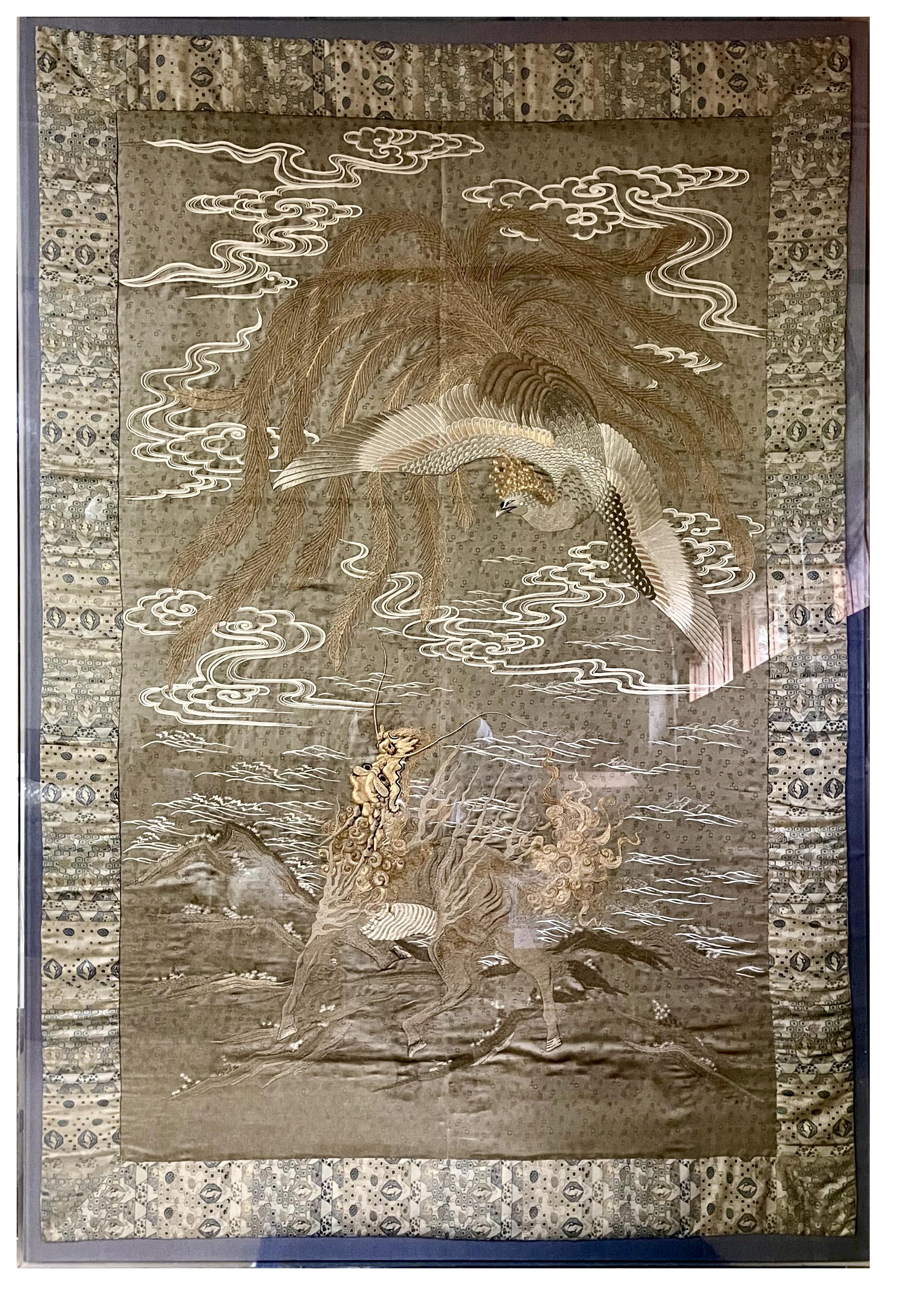 A massive Japanese embordered tapestry professionally displayed in a custom acrylic shadow box. The fine work of textile art is dated to 1890-1920s, late Meiji (1868-1912) or possibly Taisho (1912-1926) era. 
Presented with brocade border on linen