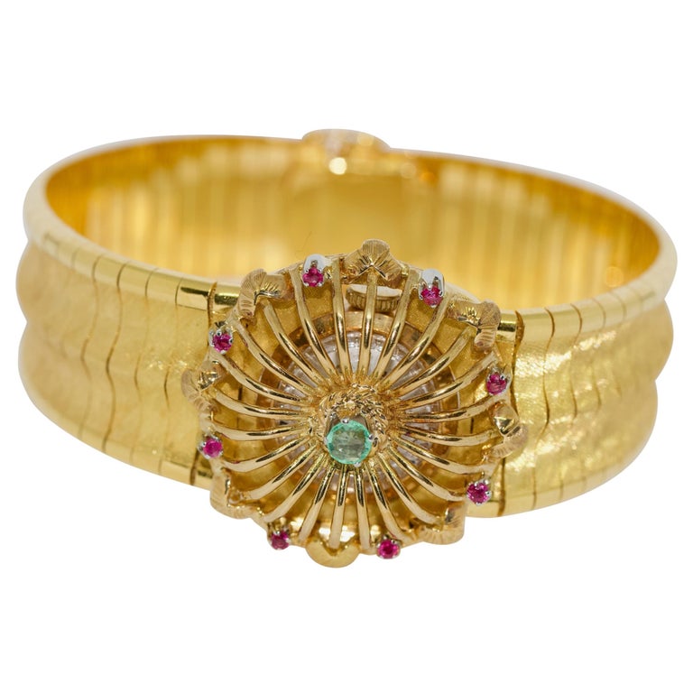 Massive Ladies Wristwatch, Bracelet, 18 Karat Gold, with Rubies and Emerald For Sale