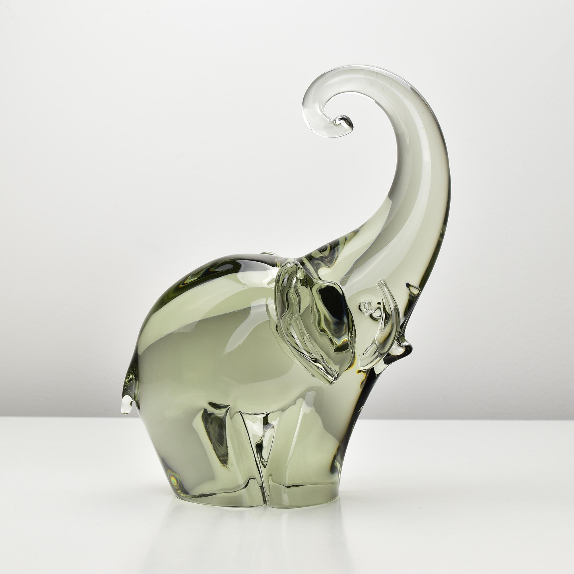 A very large and massive handcrafted elephant sculpture designed by Livio Seguso for Gral Glas. This striking piece captures the grandeur and elegance of an elephant, showcasing intricate details and a sense of movement through the medium of glass.