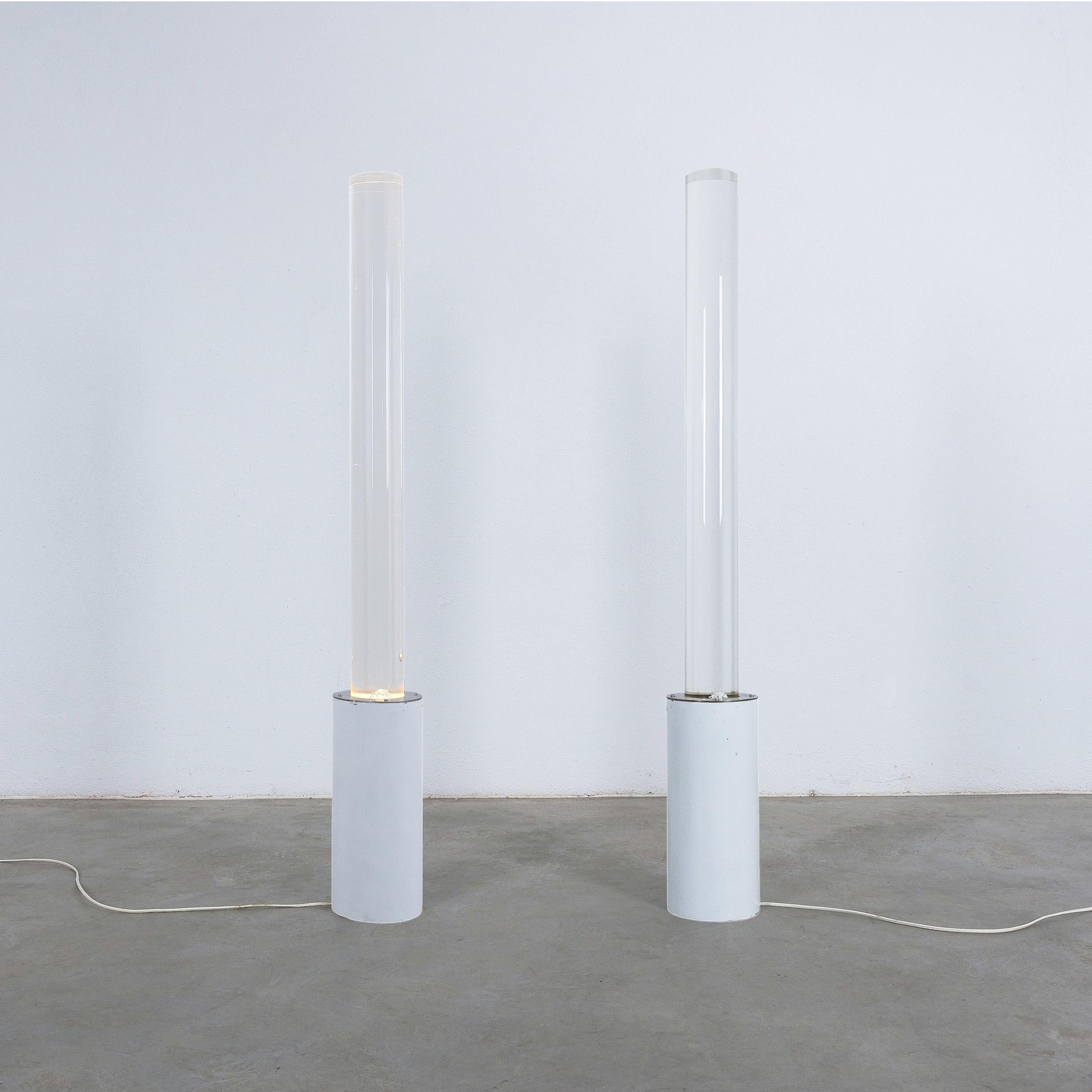 Pair of massive lucite White floor lamps, Italy, 1980
Extraordinary pair of solid lucite pole lights from the post-modern era. One of a kind pair, that was probably a bespoke design. The overall condition is very good, they give this extra glow to