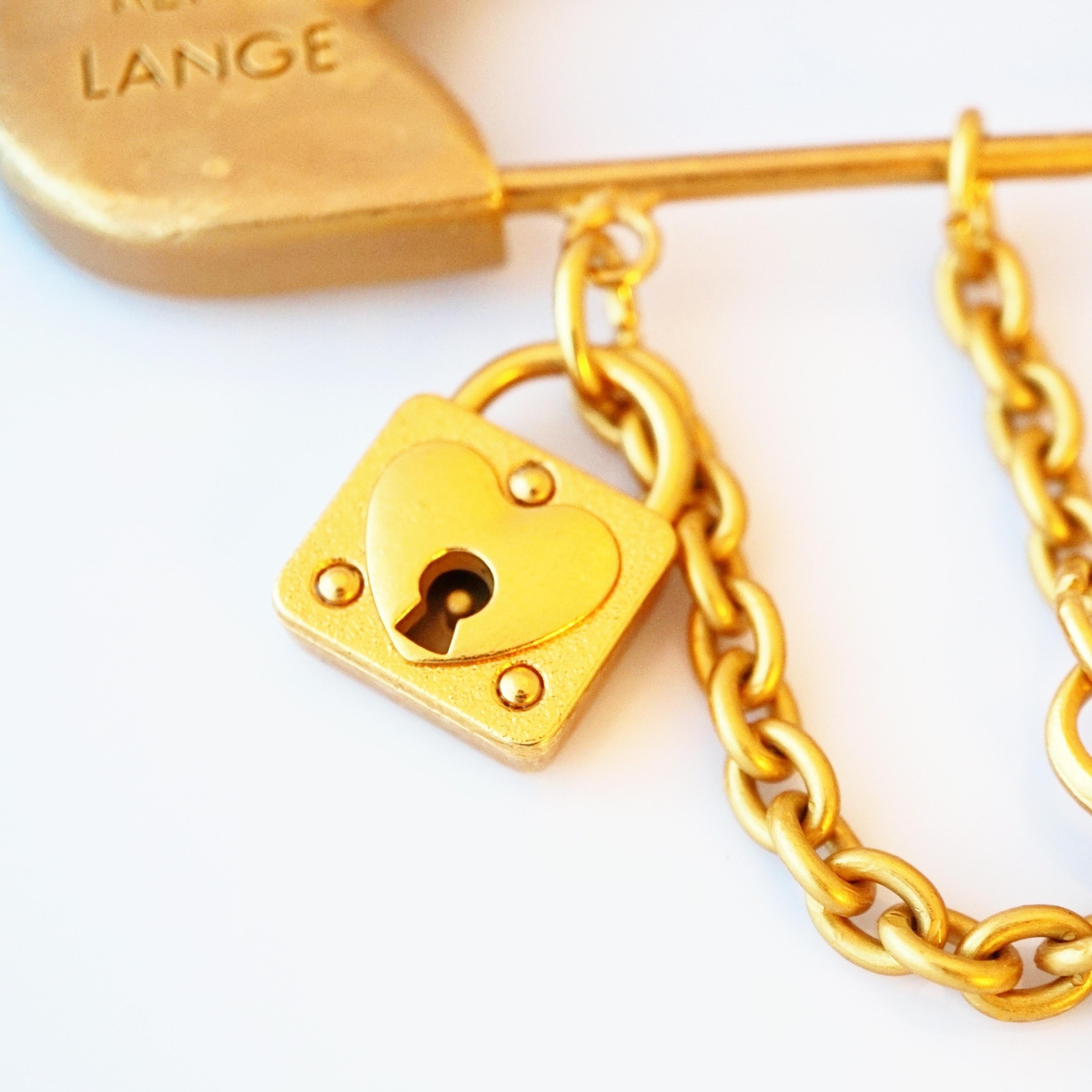 Massive Matte Gold Safety Pin Charm Brooch By Rena Lange, 1990s In Good Condition For Sale In McKinney, TX