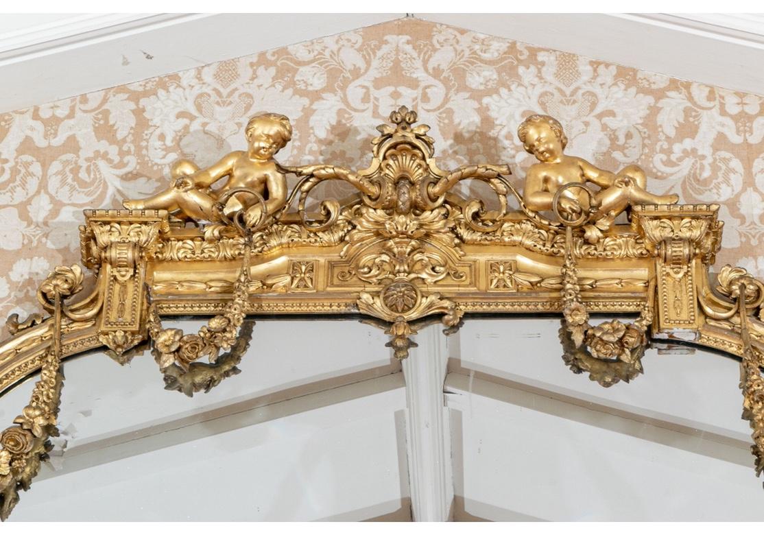 Regency Massive Mid 19th C. Carved and Gilt Mantle Mirror with Putti Crest For Sale