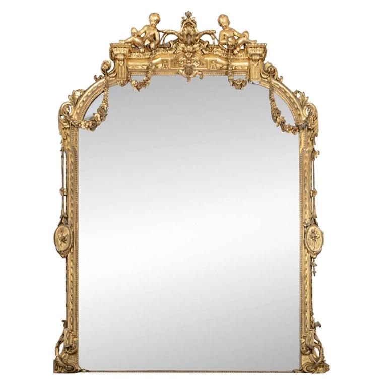 Massive Mid 19th C. Carved and Gilt Mantle Mirror with Putti Crest For Sale