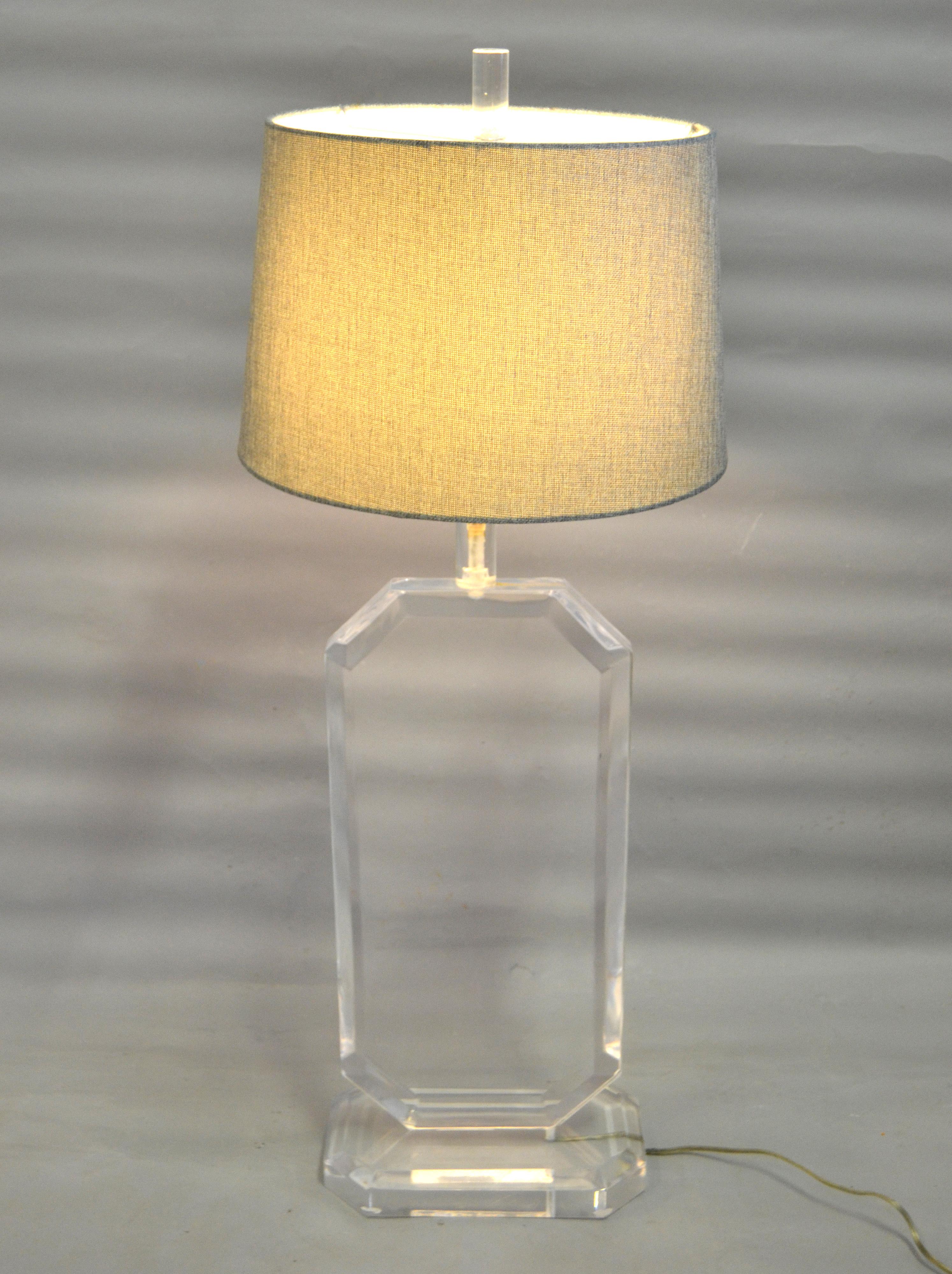 Heavy and massive Lucite table lamp with harp and finial.
The Lucite is beveled and slim, rectangular in shape, very unique design.
This table lamp looks great from any angle.
It is wired for the U.S. and comes with a switch.
Uses a max. 60