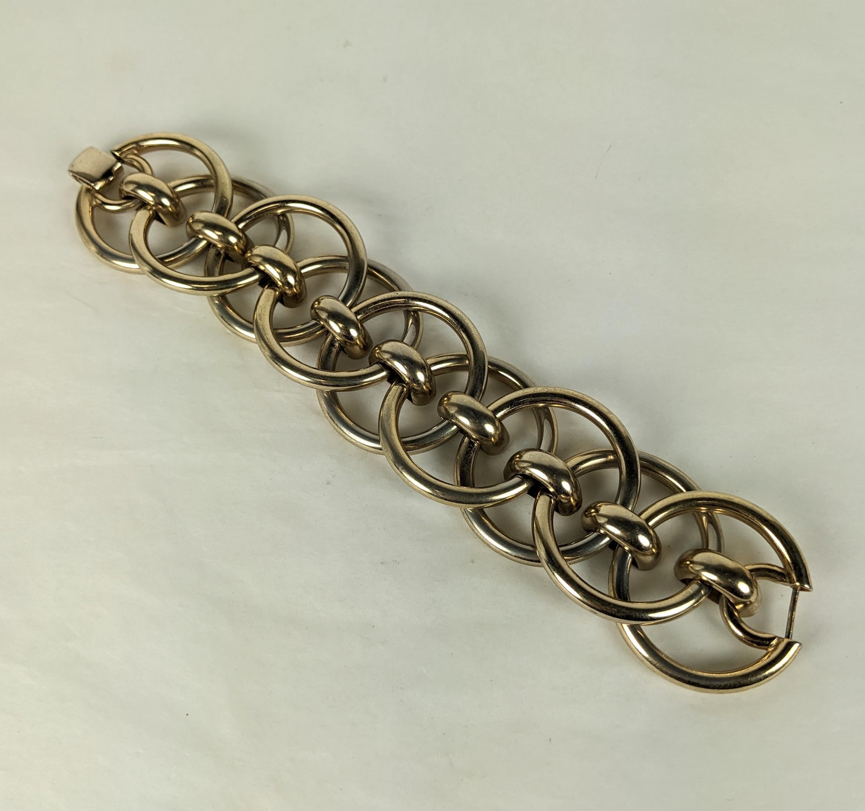 Massive Retro Monet Circle Link Bracelet from the 1940's. Wide hollow circle links alternate to form this striking link design. 
1940's USA. Signed Monet. 
9