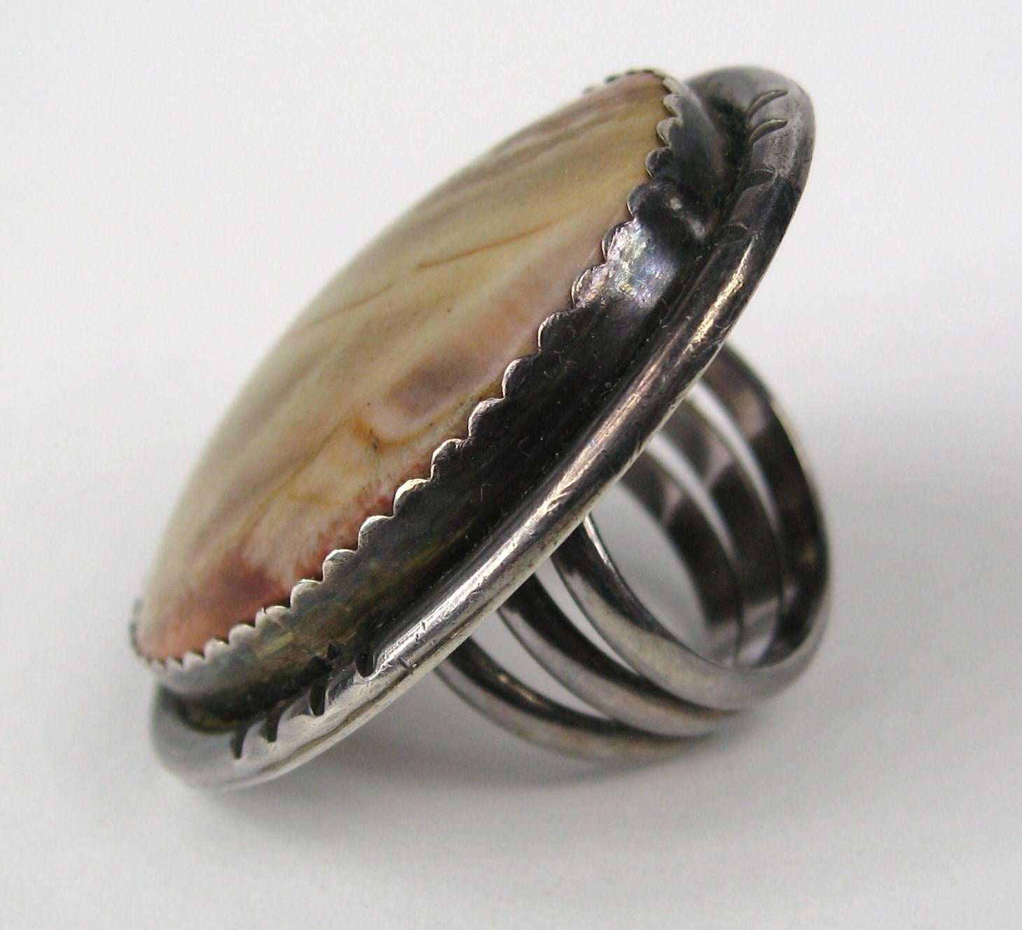 Want to make a statement, well here you go!  This is a massive ring. Measuring 1.84 in top to bottom x 1.37 in wide, Three rings make up the shank of the ring. Large Jasper stone in sterling silver. Ring is a Size 8. This is out of a massive