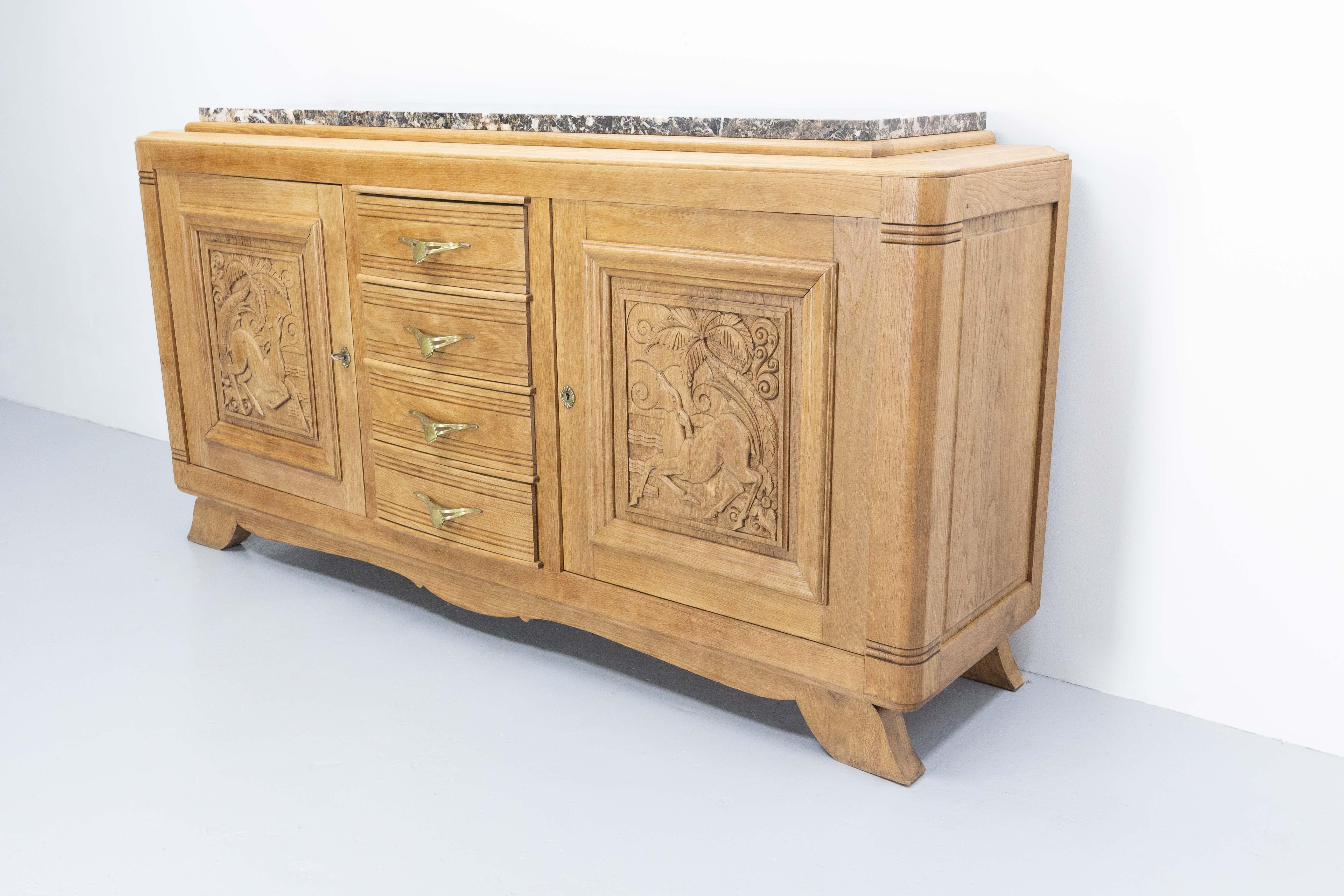 20th Century Massive Oak and Marble Top Antelopes Credenza Sideboard French Buffet, C. 1940 For Sale