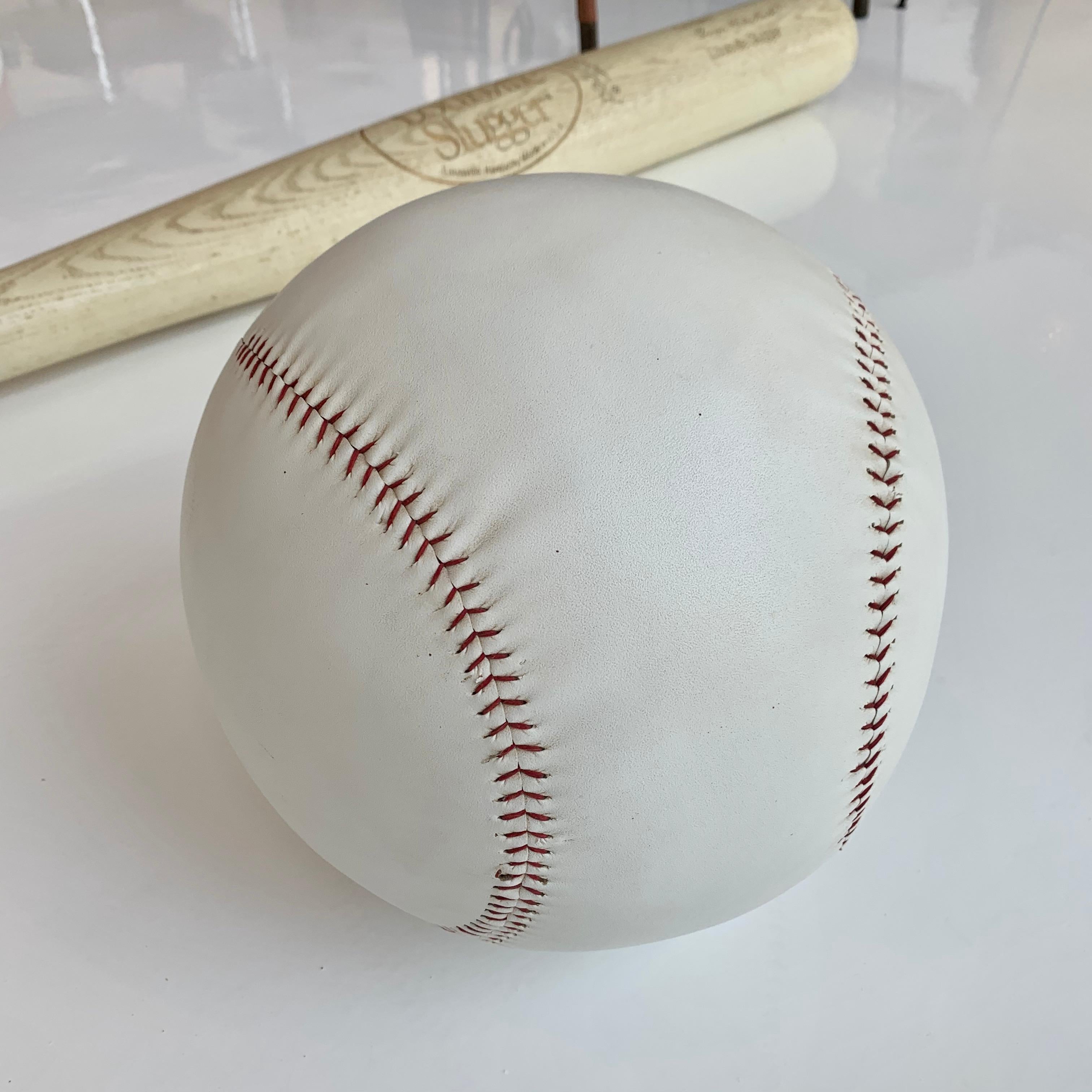 Cool oversized leather baseball. White leather with characteristic red stitching. Measures: 12