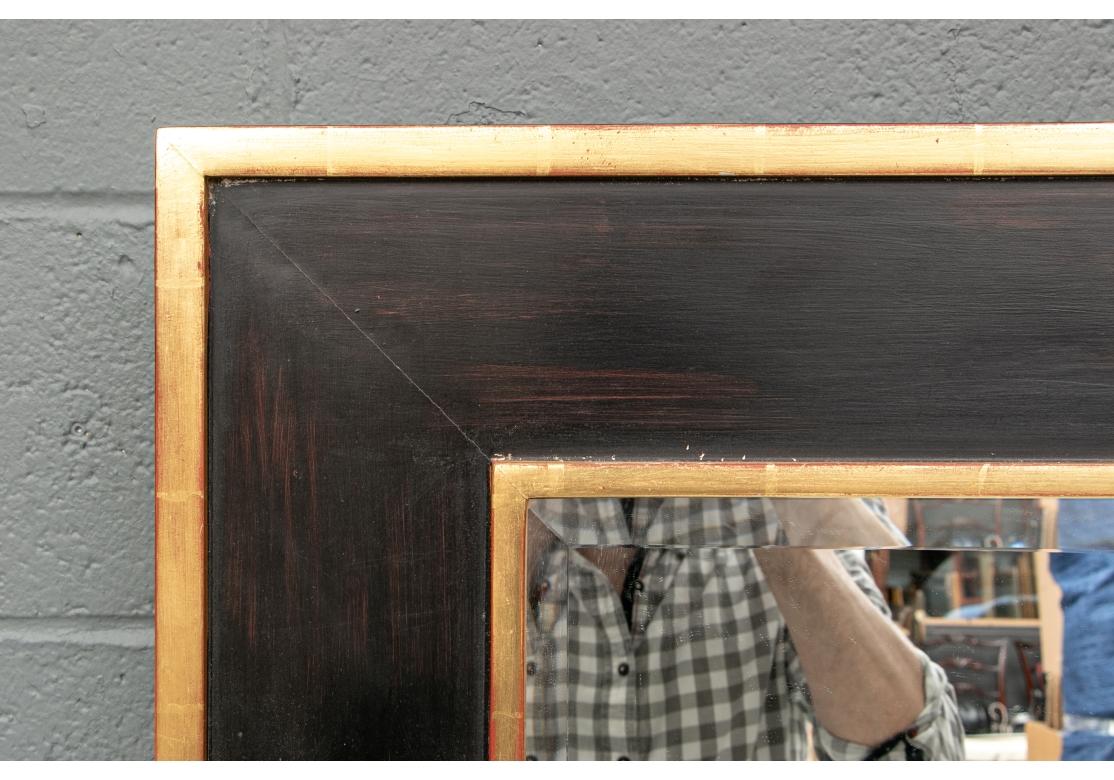 Hollywood Regency Massive Painted And Gilt Beveled Mirror With Sconces For Sale