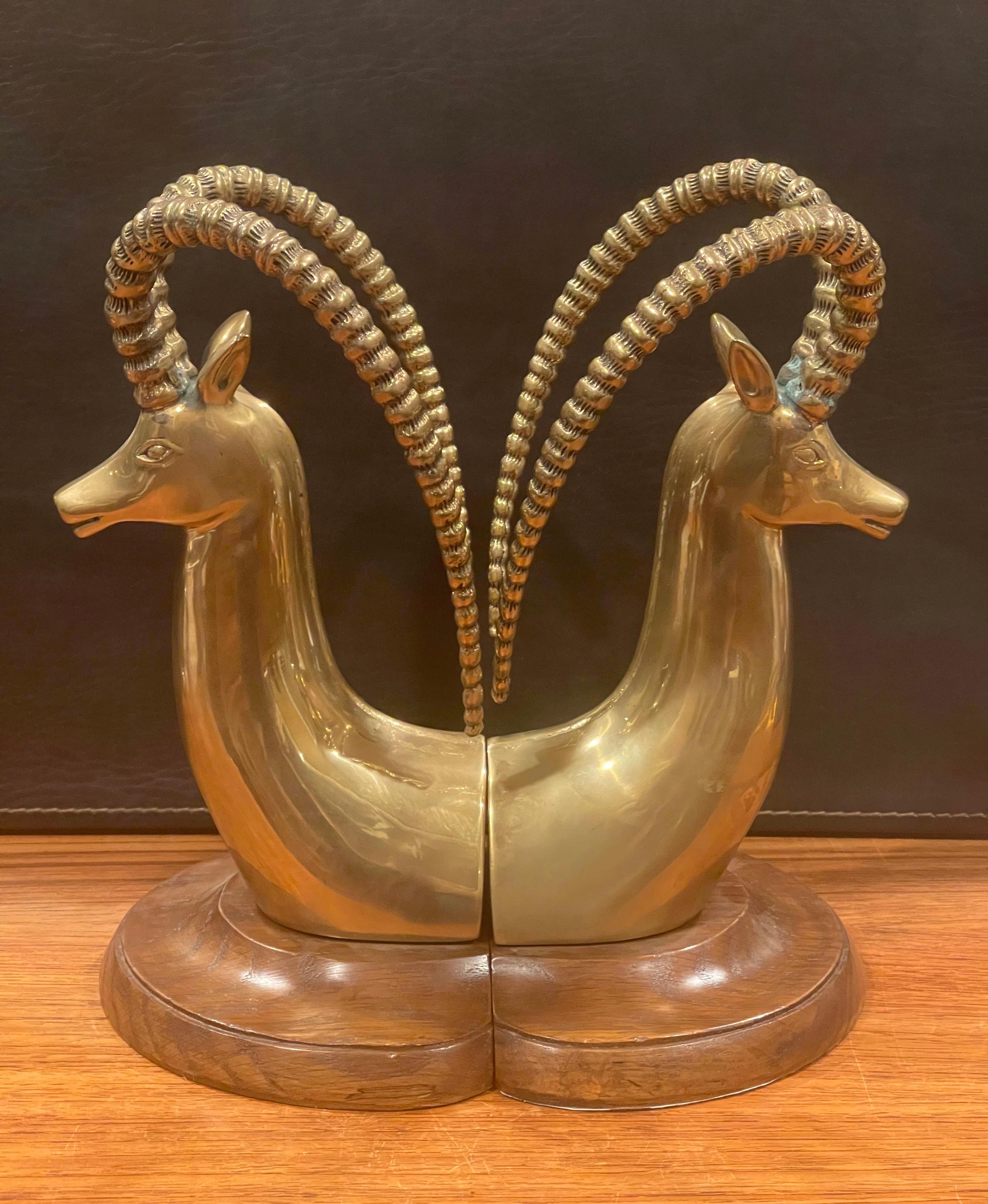 Spanish Massive Pair of Brass on Walnut Base Rams Head Bookends by Sarreid For Sale