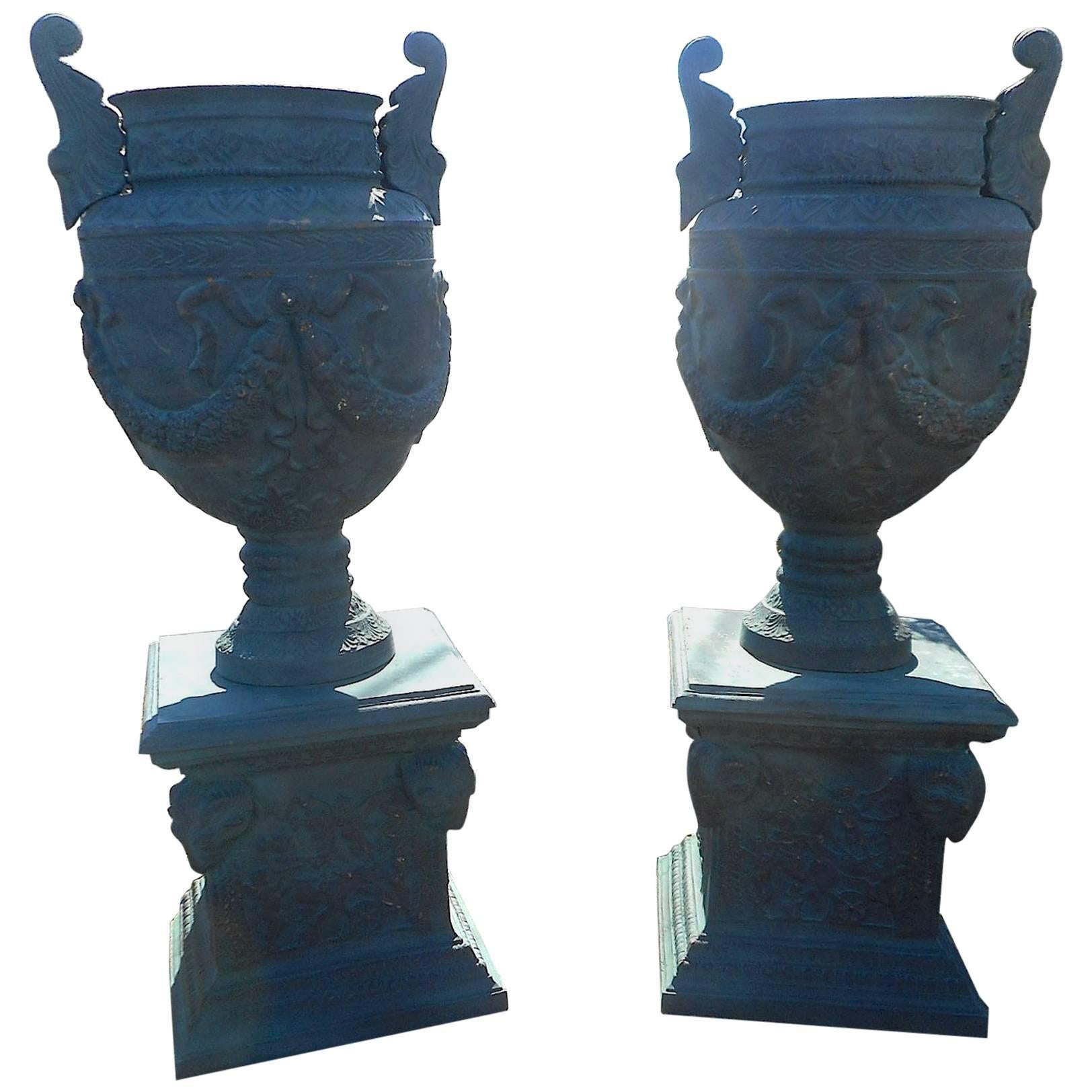 Massive Pair of Cast Iron Urns on Pedestal Bases