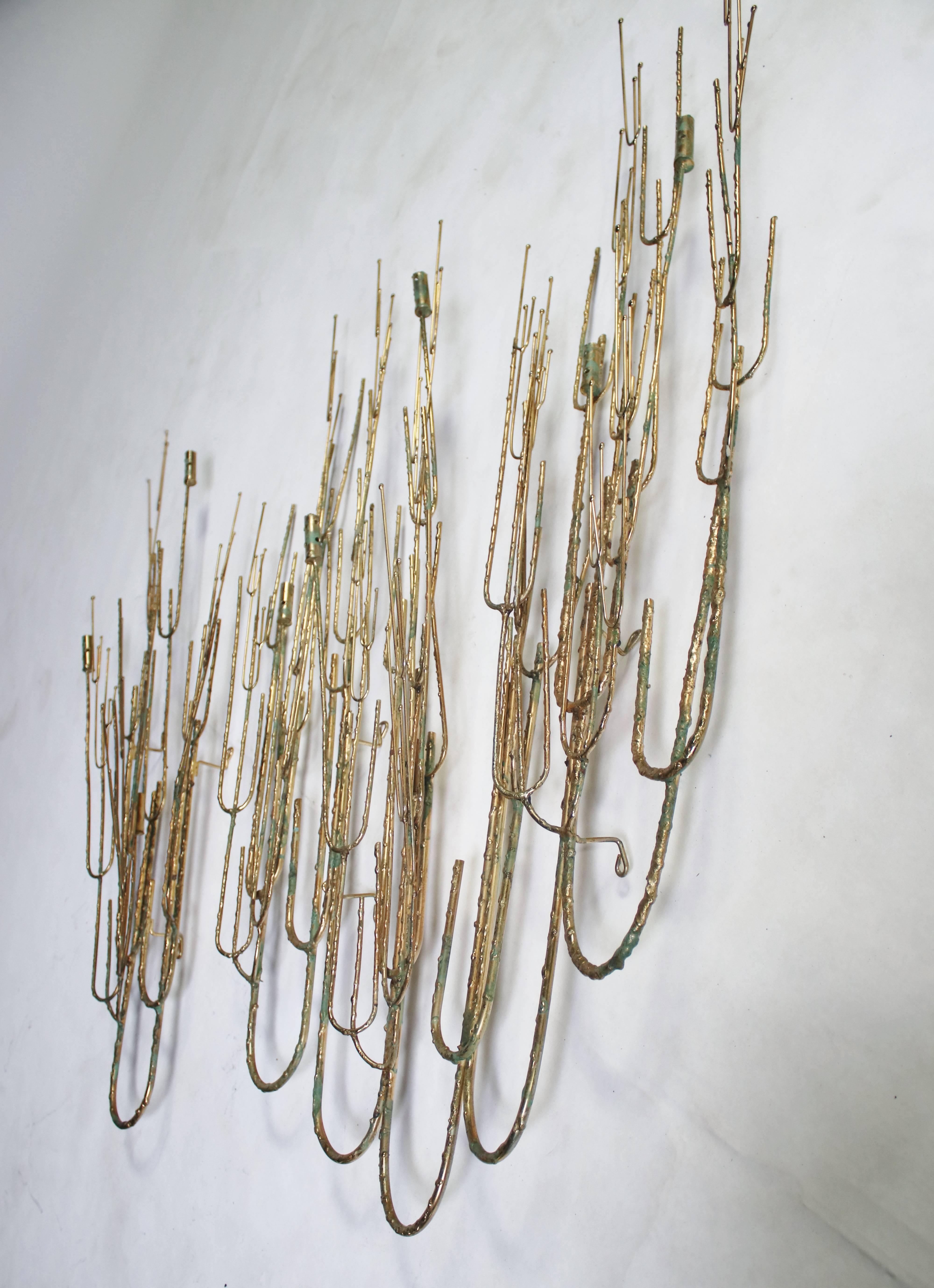 Pair of wall sculptures in the design of pussy willows with candelabra by Curtis Jere. Set includes one larger sculpture measuring 38