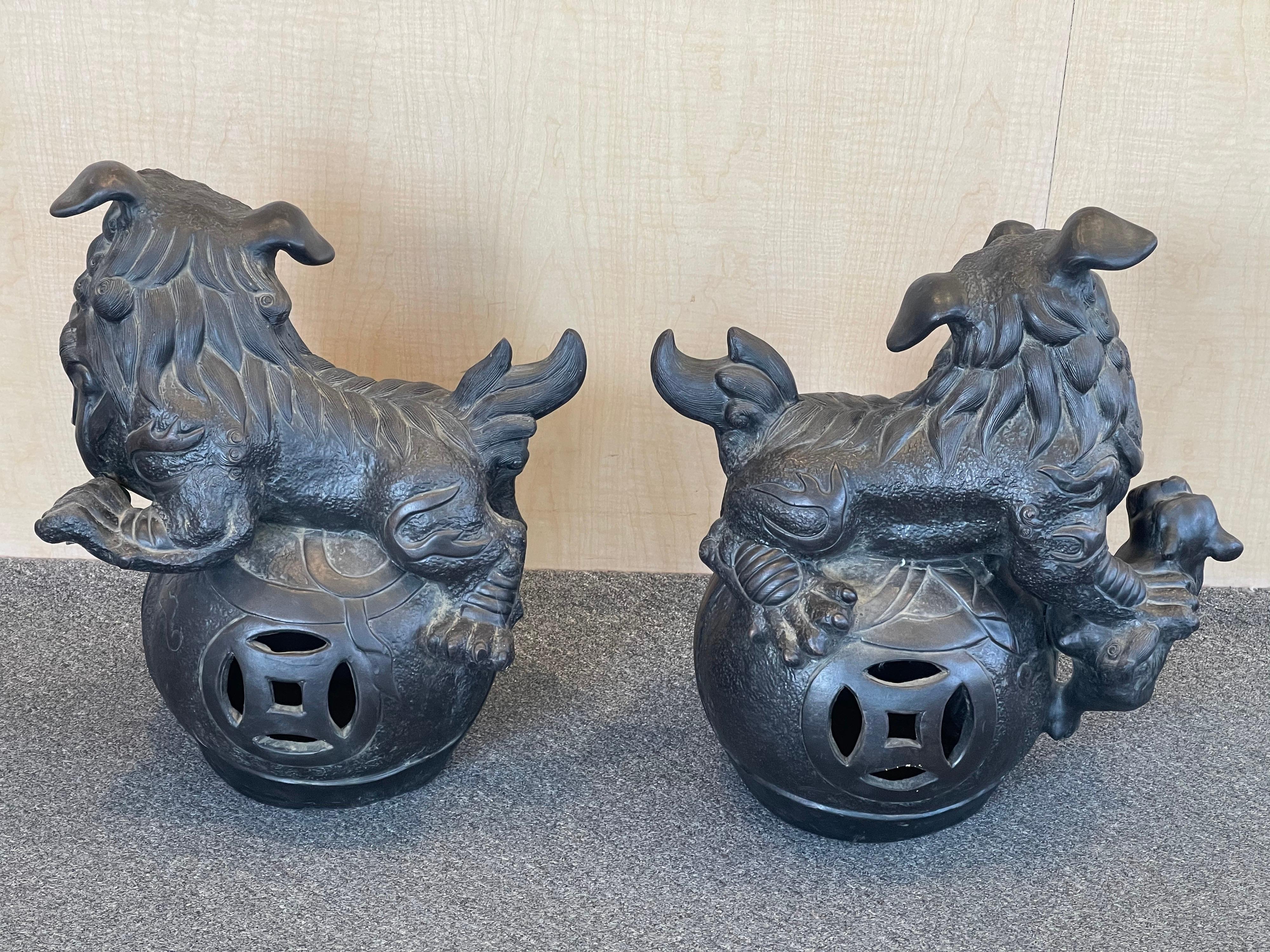 20th Century Massive Pair of Ebonized Pottery Chinese Foo Dogs For Sale