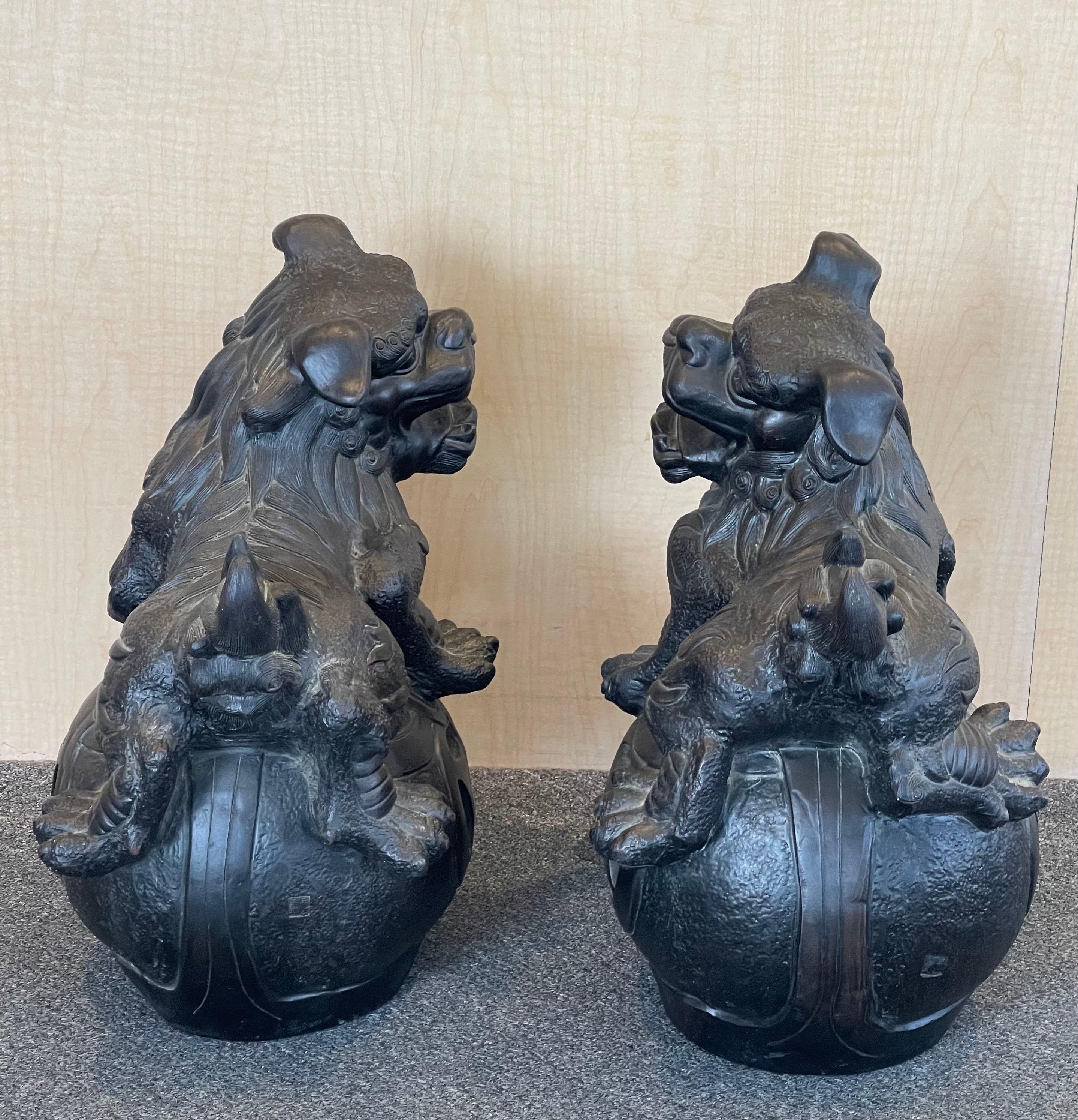 Massive Pair of Ebonized Pottery Chinese Foo Dogs For Sale 1
