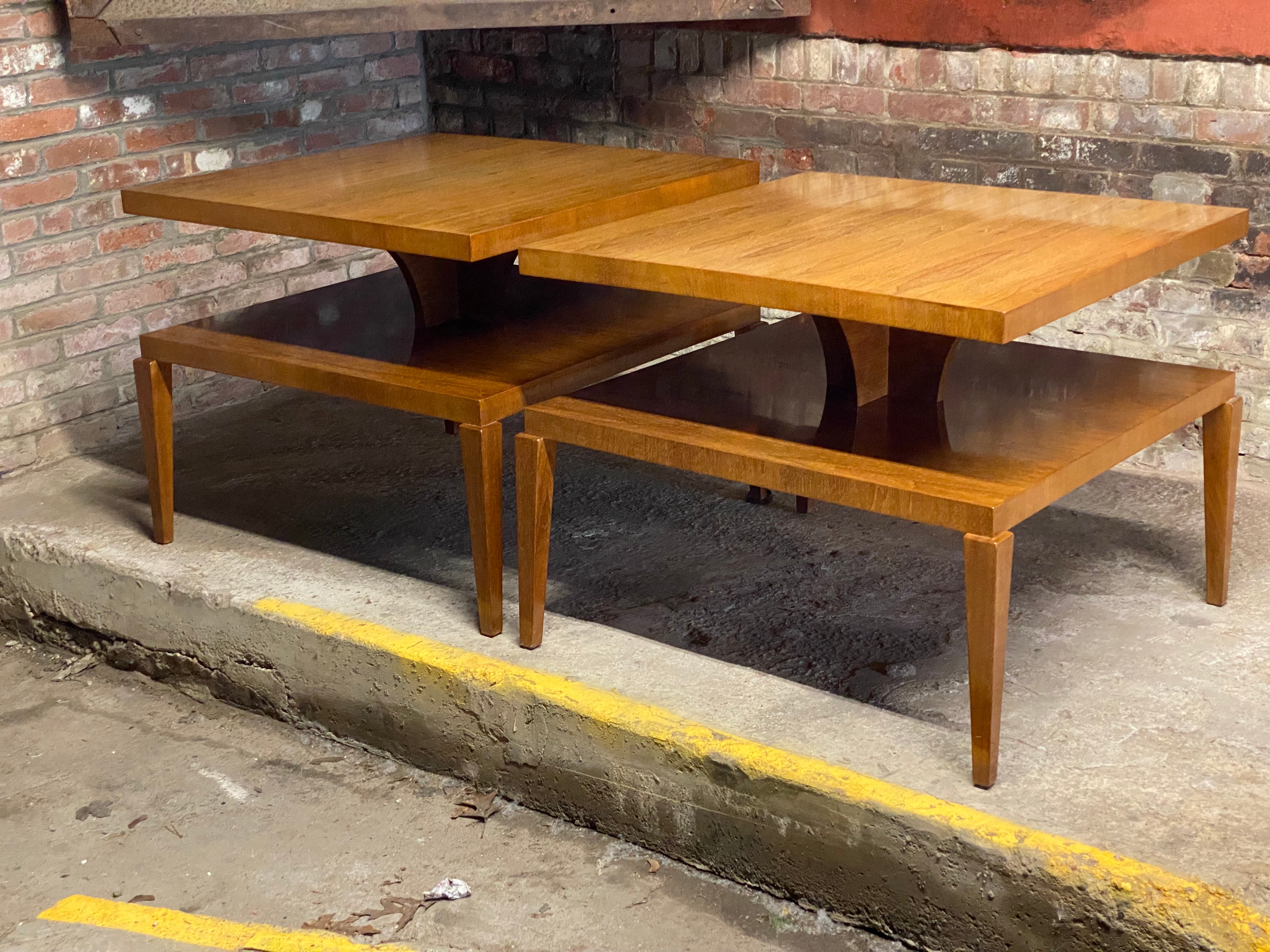 A fantastic massive pair of signed Glenrud end tables. Amazing presence due to their size, quality and refinement. Featuring tow tiered construction, curved support structure for the top and elegant tapered legs. Both examples retain the Glenrud