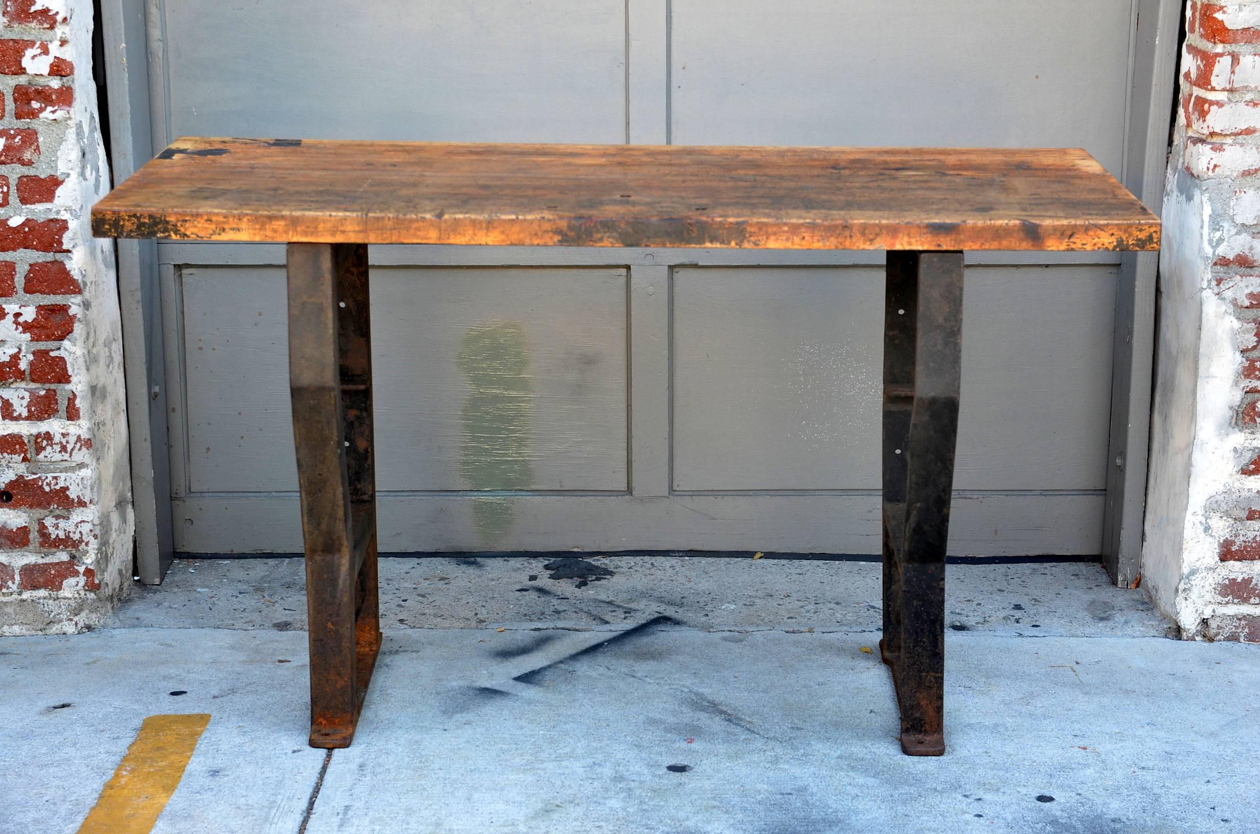 Massive patinated industrial console. The base attaches to the wall and/or the floor.