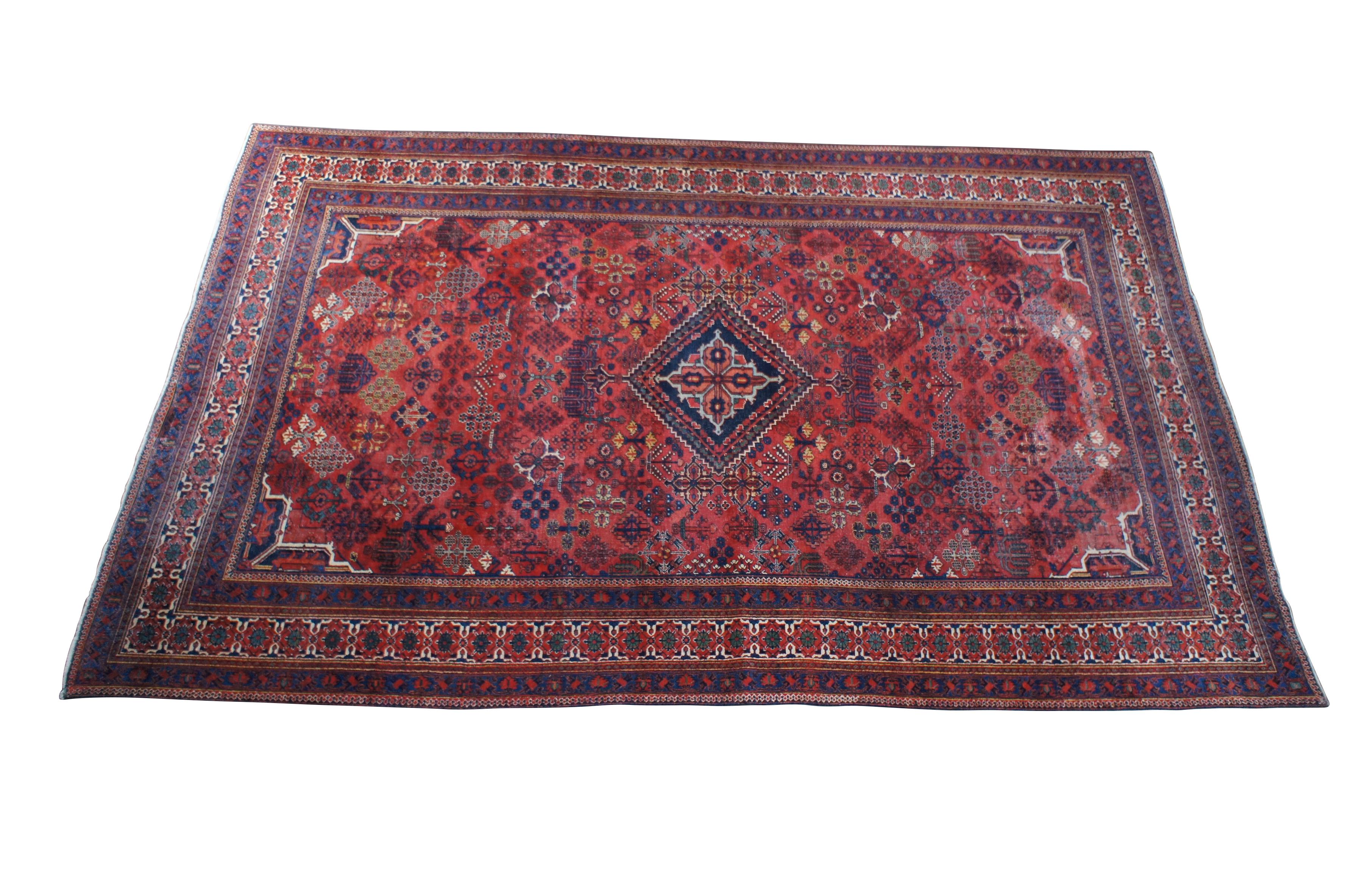 A very large and impressive vintage Persian Iran Joshegan palace rug or carpet.  Made of wool featuring traditional geometric and floral design with central medallion.  225 knots per square inch.  Reds, blues, green, orange, beige, yellow, peach.

A