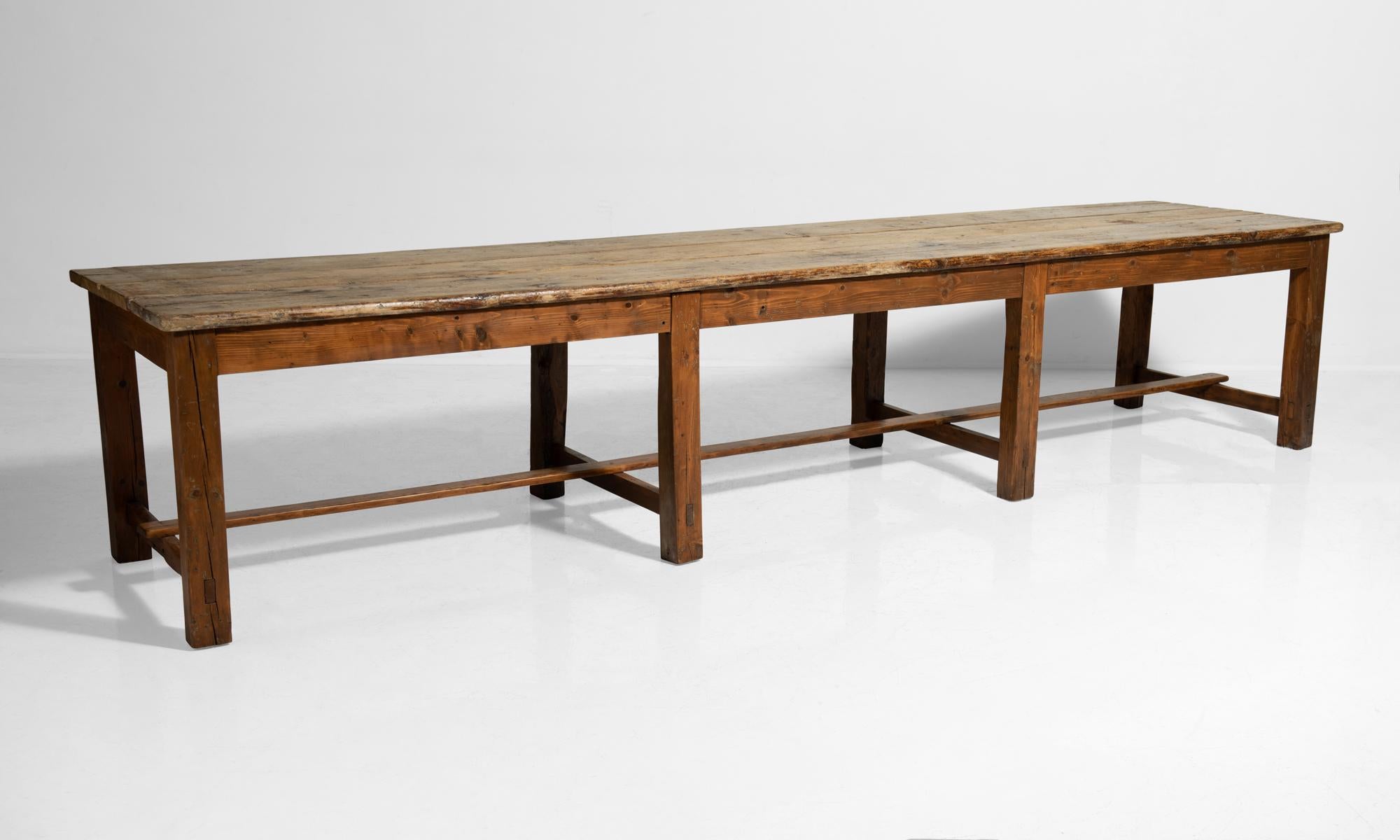 Massive pine worktable, Italy, circa 1900.

Beautifully patinated wood with stretcher supports and two large drawers on each end.