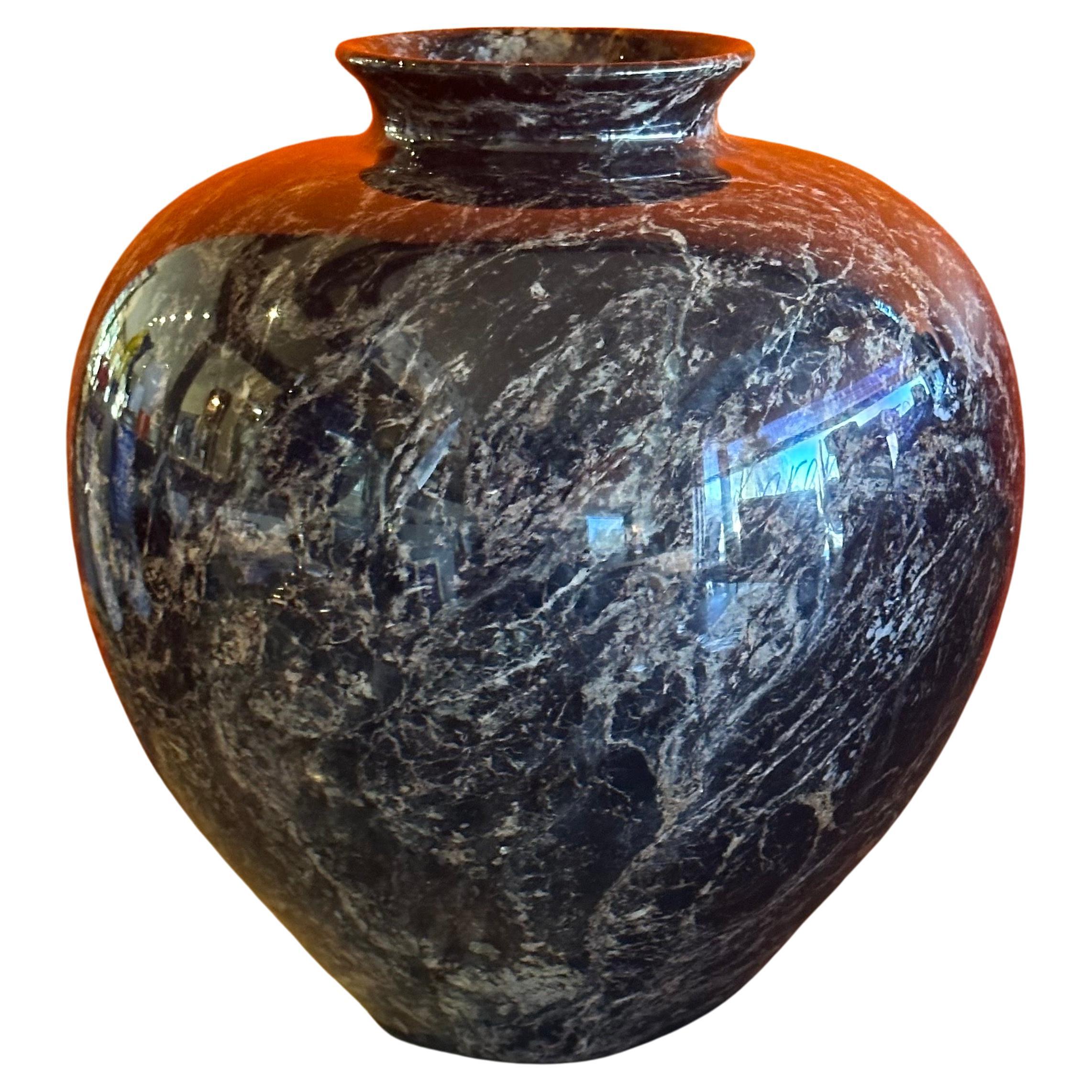 Massive post-modern Italian black marble vase, circa 1980s. The vase has a black background with tan, white and grey veining throughout.  The vase is in very good vintage condition with no chips or cracks and measures 12