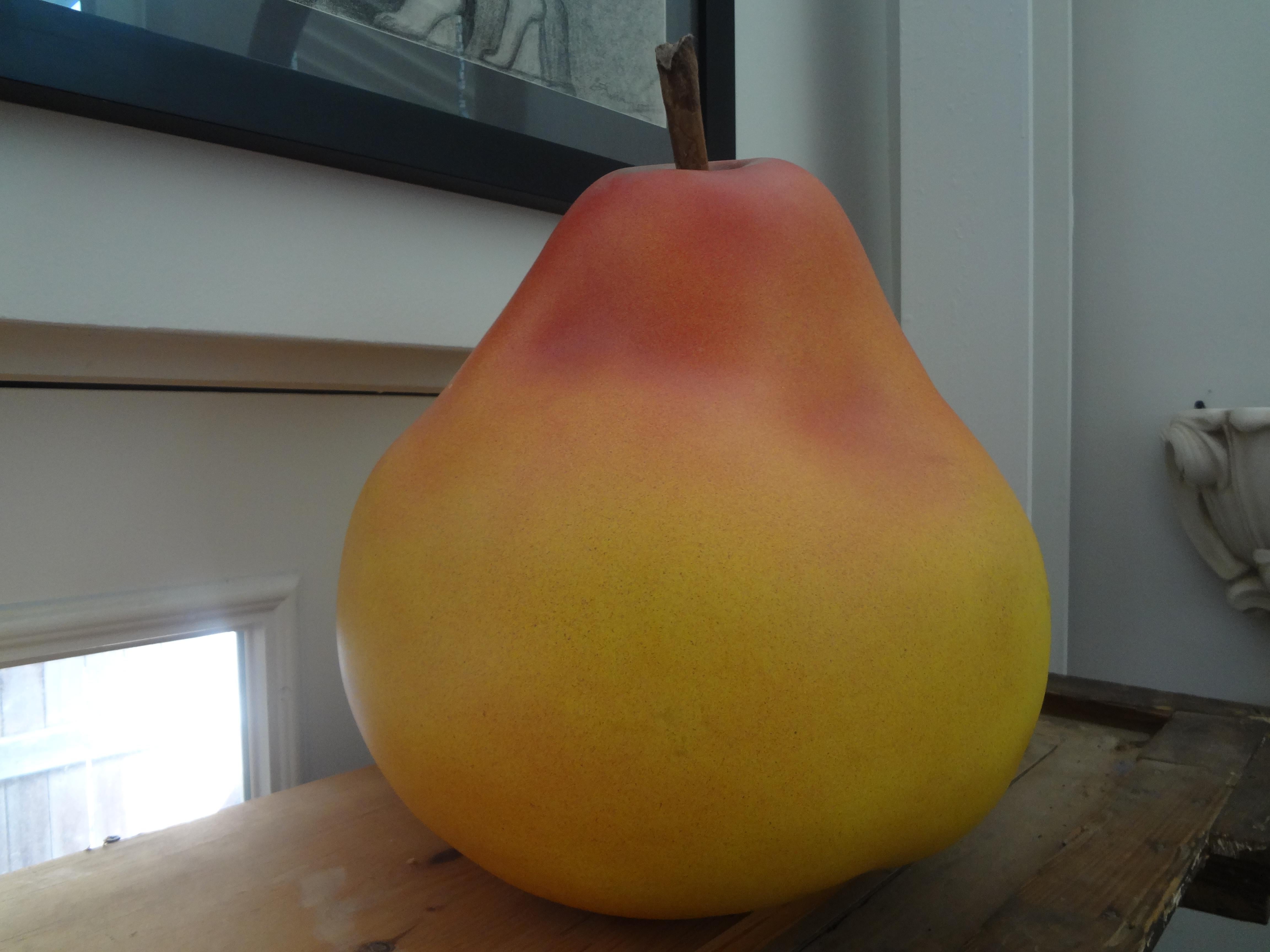 Massive postmodern Pop Art ceramic pear.
Large postmodern Pop Art ceramic pear with a wood stem. This fruit sculpture is extremely realistic looking. This gorgeous fruit is most likely Italian in origin.
Stunning accessory!