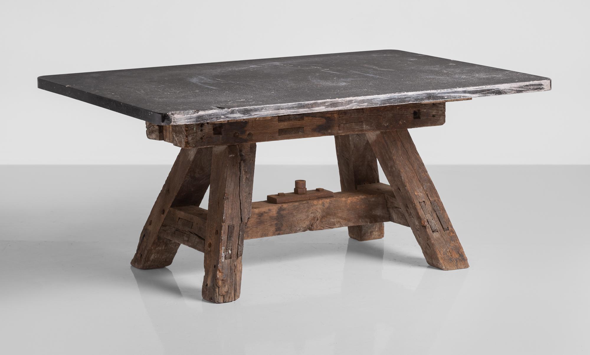 Massive pottery table, France, circa 1950

Thick slab top sits on a substantial A-frame base.