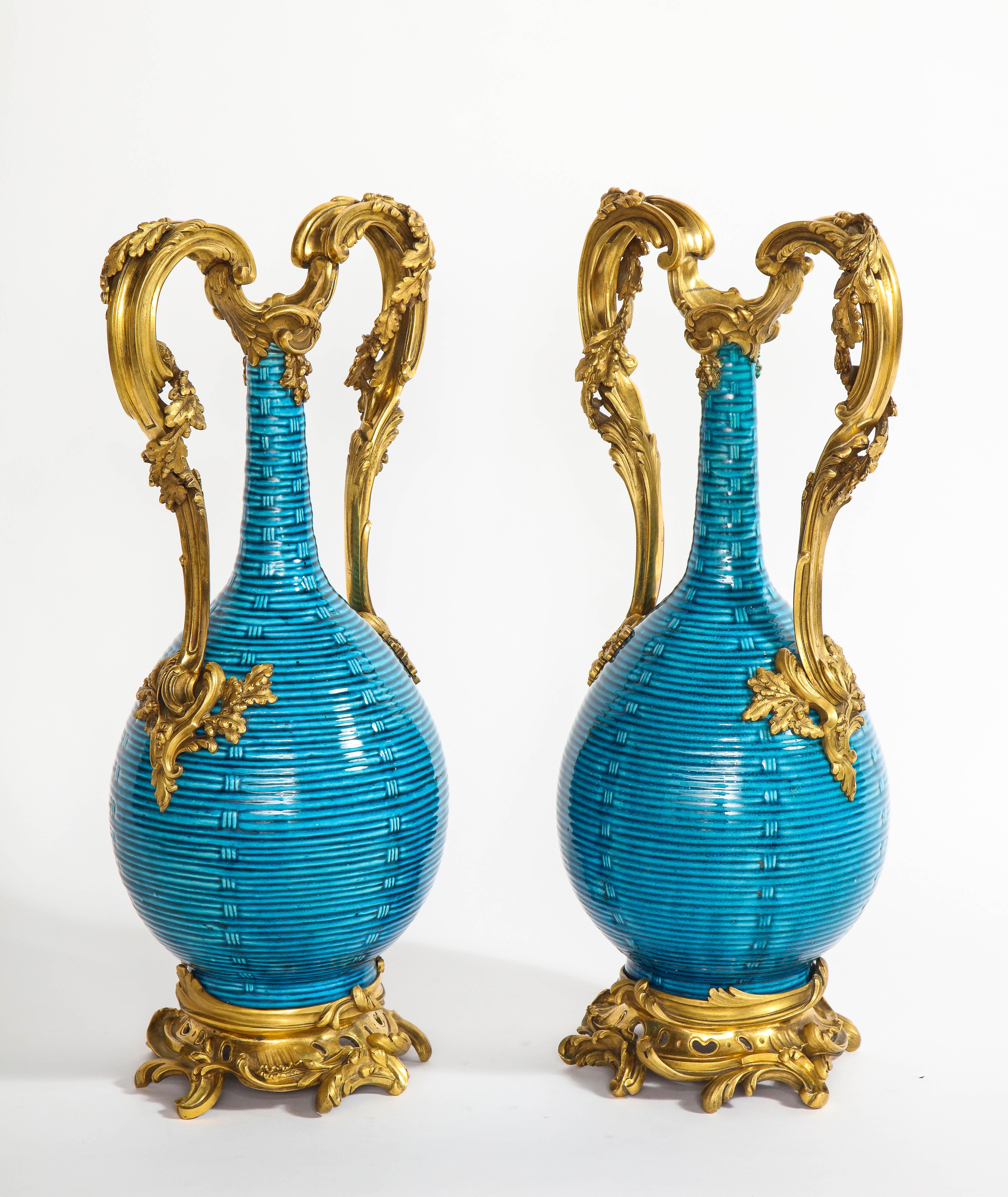 A magnificent and exceptional pair of massive antique French 18th century Louis XV period doré bronze and Chinese Turquoise ground porcelain hand engraved basket weave form vases. The porcelain, Chinese and first half of 18th century and the ormolu,