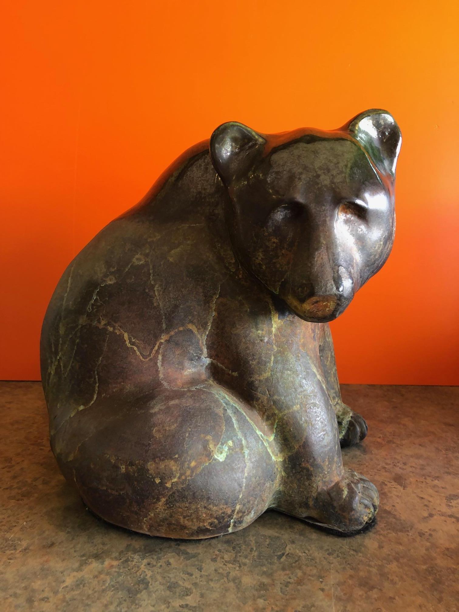 Stunning large raku pottery seated bear by Tony Evans, circa 1970s. The piece is signed and extremely well crafted; ithas wonderful green and brown colors and interesting glaze work.
