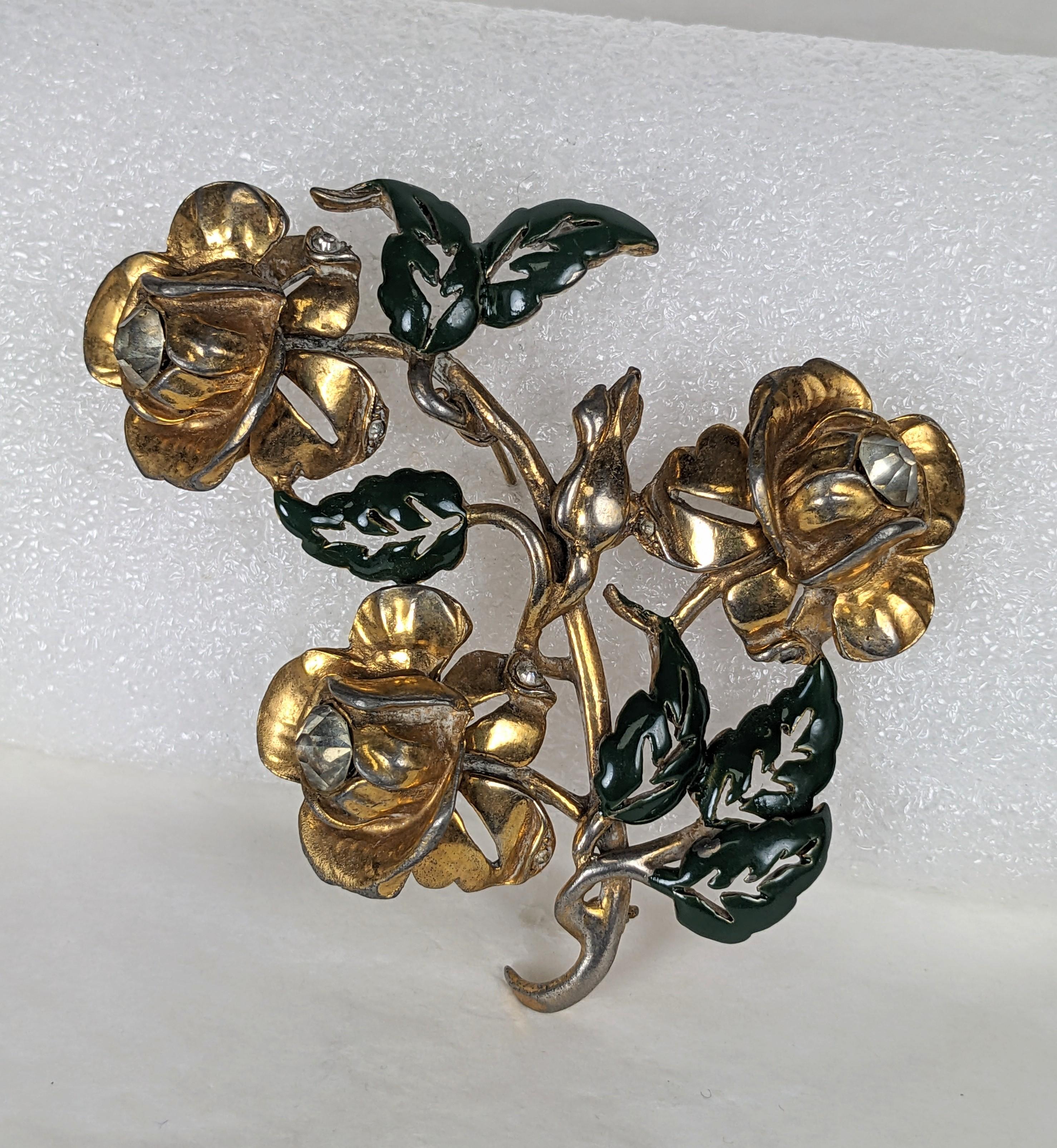 Massive Retro Flower Spray from the 1940's. Unsigned but likely made by Reja, with pierced leaves. Large gilt rose flowerheads with crystal centers are set on a large spray with enamel green leaves. 
3.5
