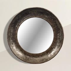 Grand miroir industriel rond encadré d'acier massif